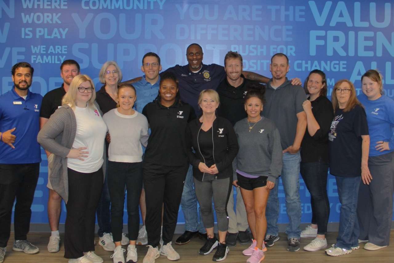 Former NBA player and Founder of the "One and Done Foundation", Korleone Young with Salina Family YMCA staff. Courtesy of Salina Family YMCA