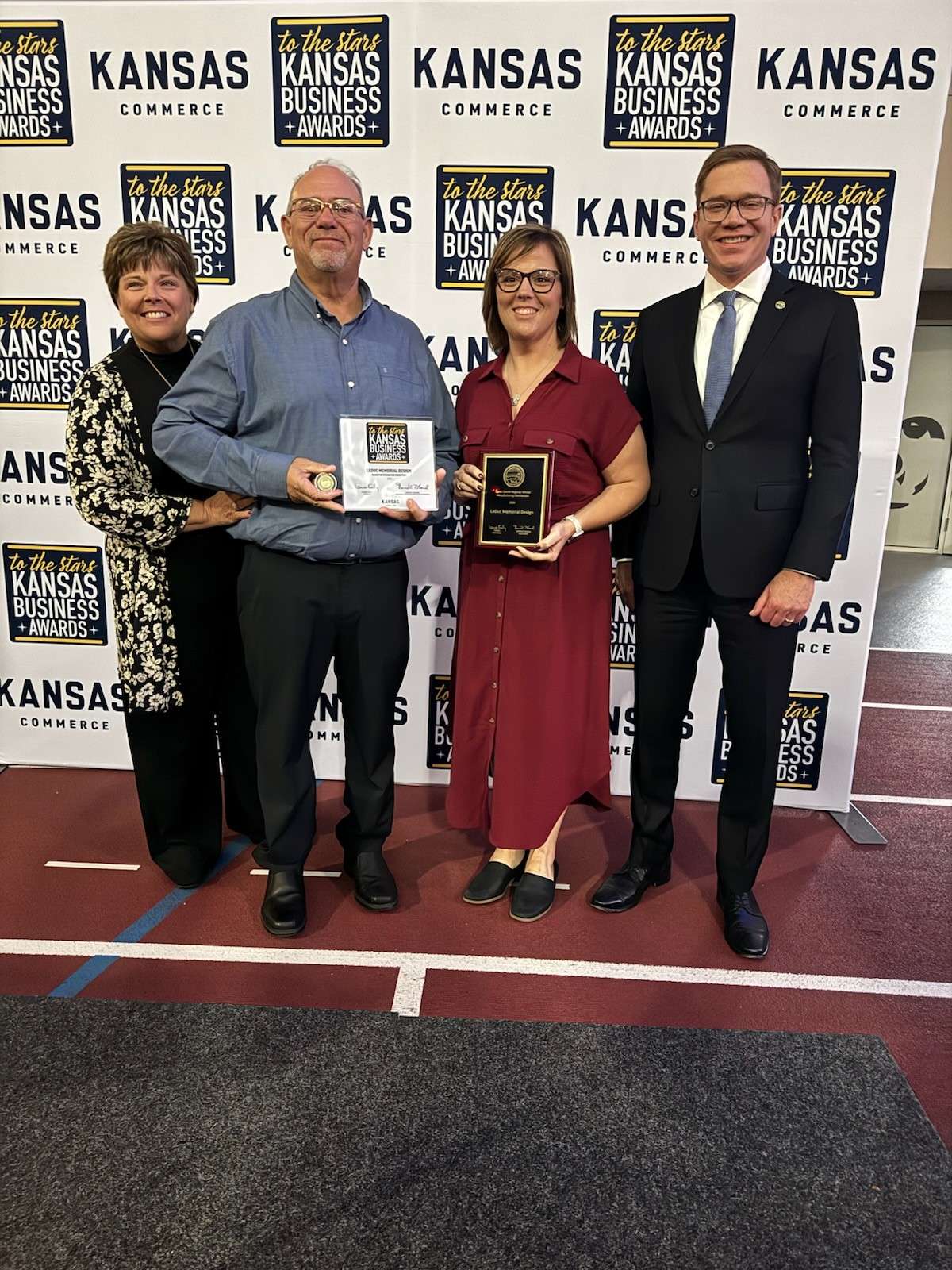 Pictured left to right: Shirley & Troy LeDuc, Missy (LeDuc) Kindel, and Lieutenant Governor and Secretary of Commerce David Toland. 