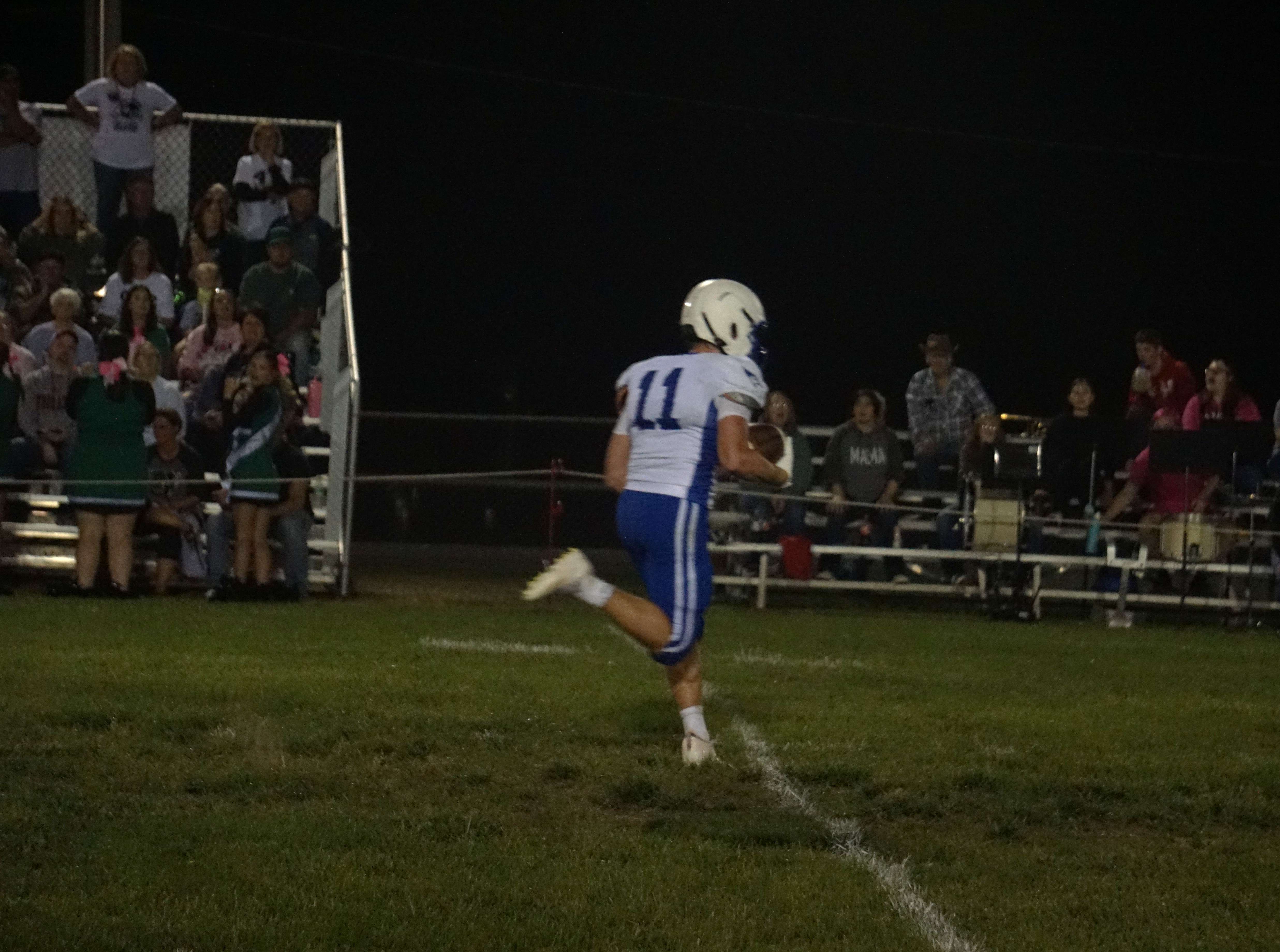 Brock Holmes rushes for a touchdown against Nodaway Valley/ Photo by Matt Pike
