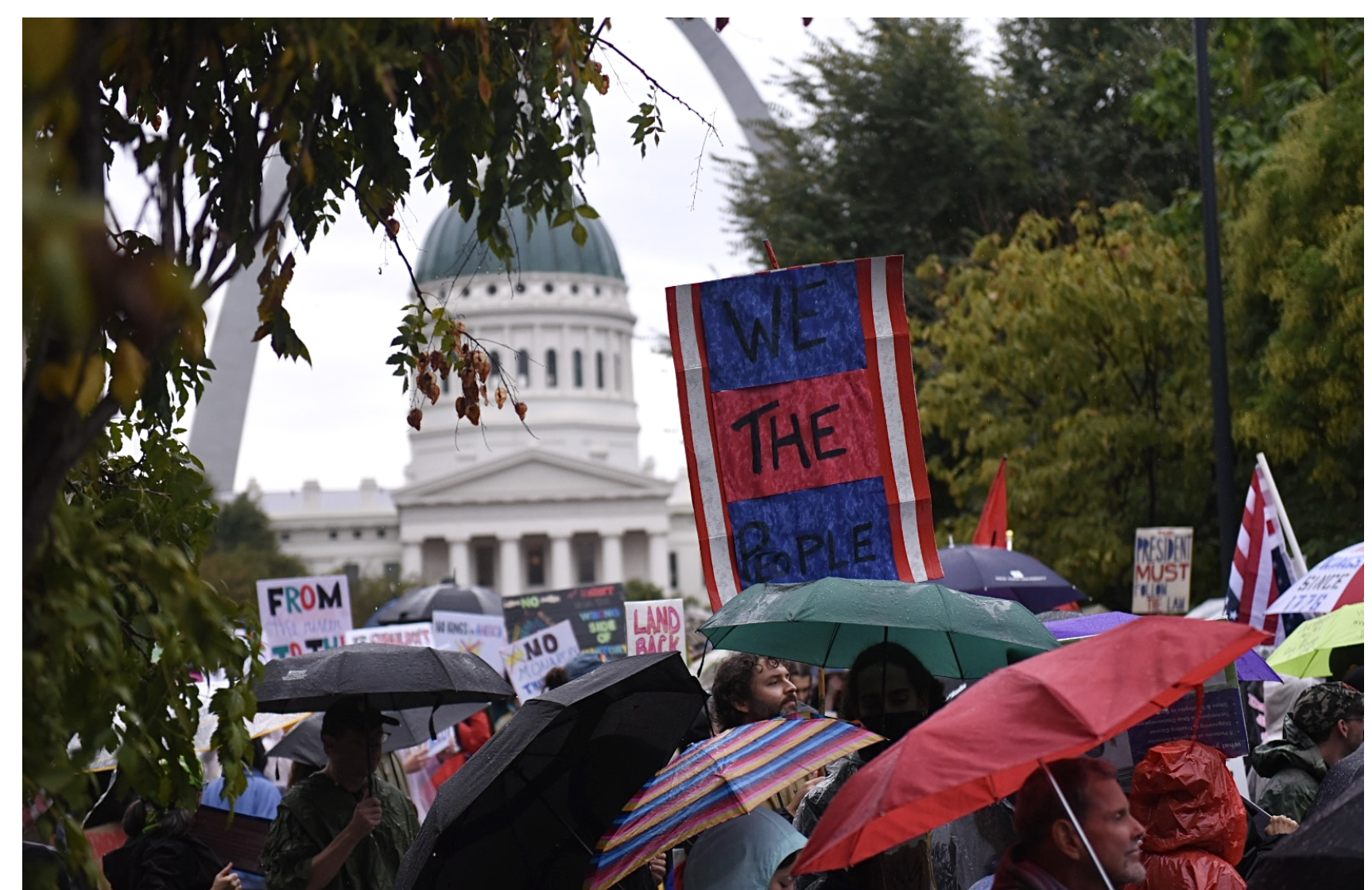 More than a thousand people gather in a thunderstorm on Saturday as part of a No Kings protest in downtown St. Louis (Anna Spoerre/Missouri Independent).