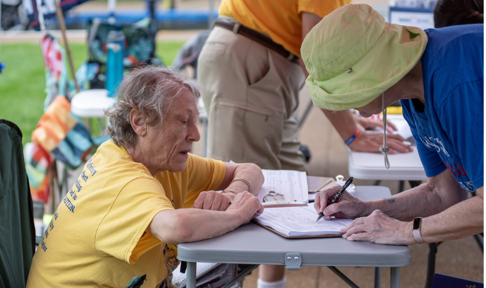 Sue Gibson, a volunteer with Respect Missouri Voters, collects signatures during the No Kings demonstration at the Missouri State Capitol in Jefferson City on Saturday. Respect Missouri Voters is the intiative petition campaign for a constitutional amendment that would make it harder for the General Assembly to overturn citizen-led ballot measures (Annelise Hanshaw/Missouri Independent).