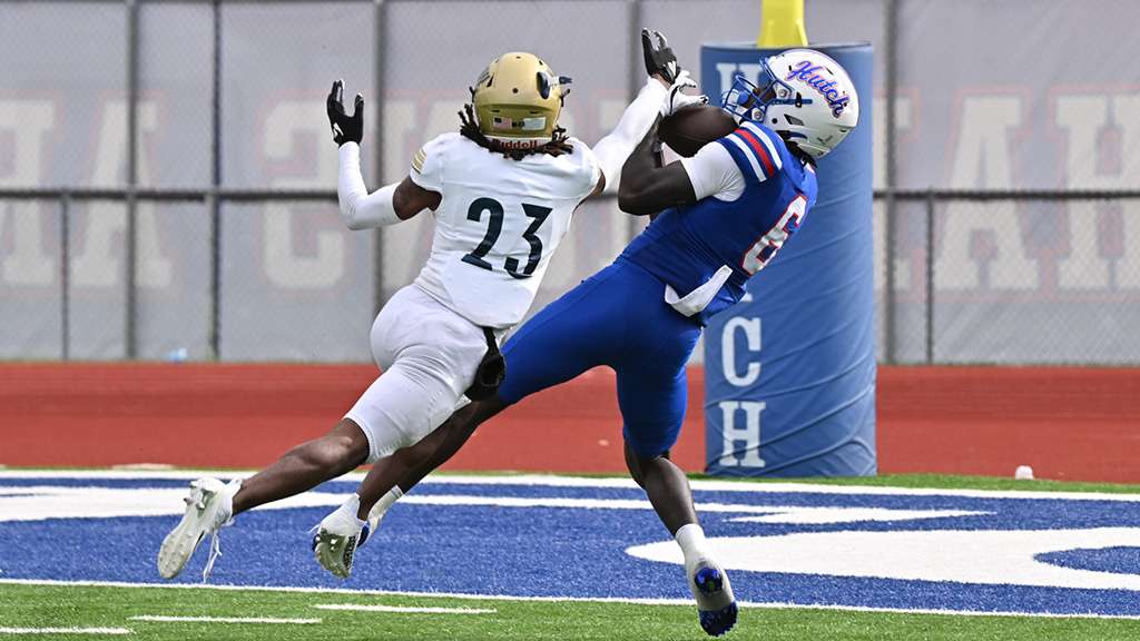Derrick Salley Jr. (6) catches one of his three touchdown passes on Saturday in the No. 1-ranked Blue Dragons' 71-12 victory over the Independence Pirates on Saturday at Gowans Stadium. (Andrew Carpenter/Digital Fox Photography)