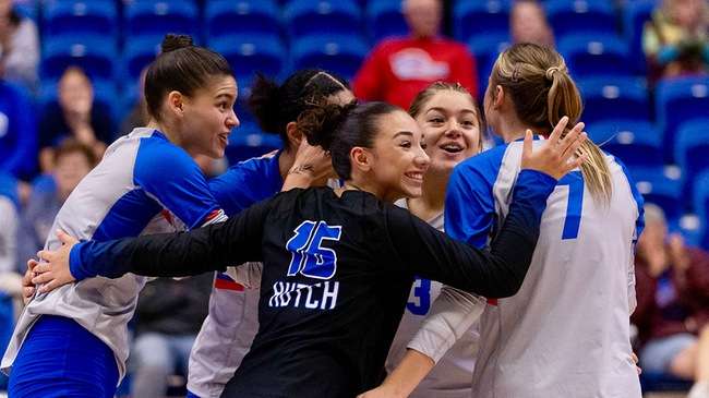 The Blue Dragon volleyball team celebrates a Priscilla Rachen ace serve in the third set of a 3-0 KJCCC sweep of the Cloud County Thunderbirds on Saturday at the Sports Arena. (Sydney Holzrichter/Blue Dragon Sports Information)