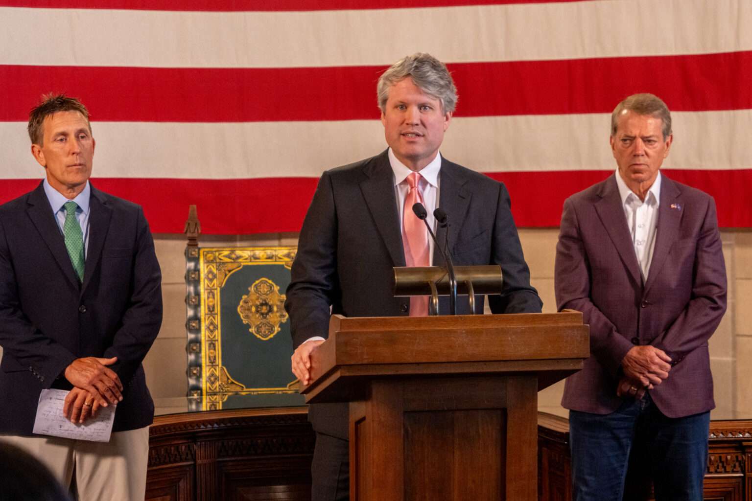 Nebraska Attorney General Mike Hilgers, at center, and Gov. Jim Pillen, at right, announce a lawsuit against Colorado before the U.S. Supreme Court seeking to assert Nebraska’s water rights to the South Platte River that crosses state lines. At left is Jesse Bradley, director of the Nebraska Department of Water, Energy and Environment. July 16, 2025.