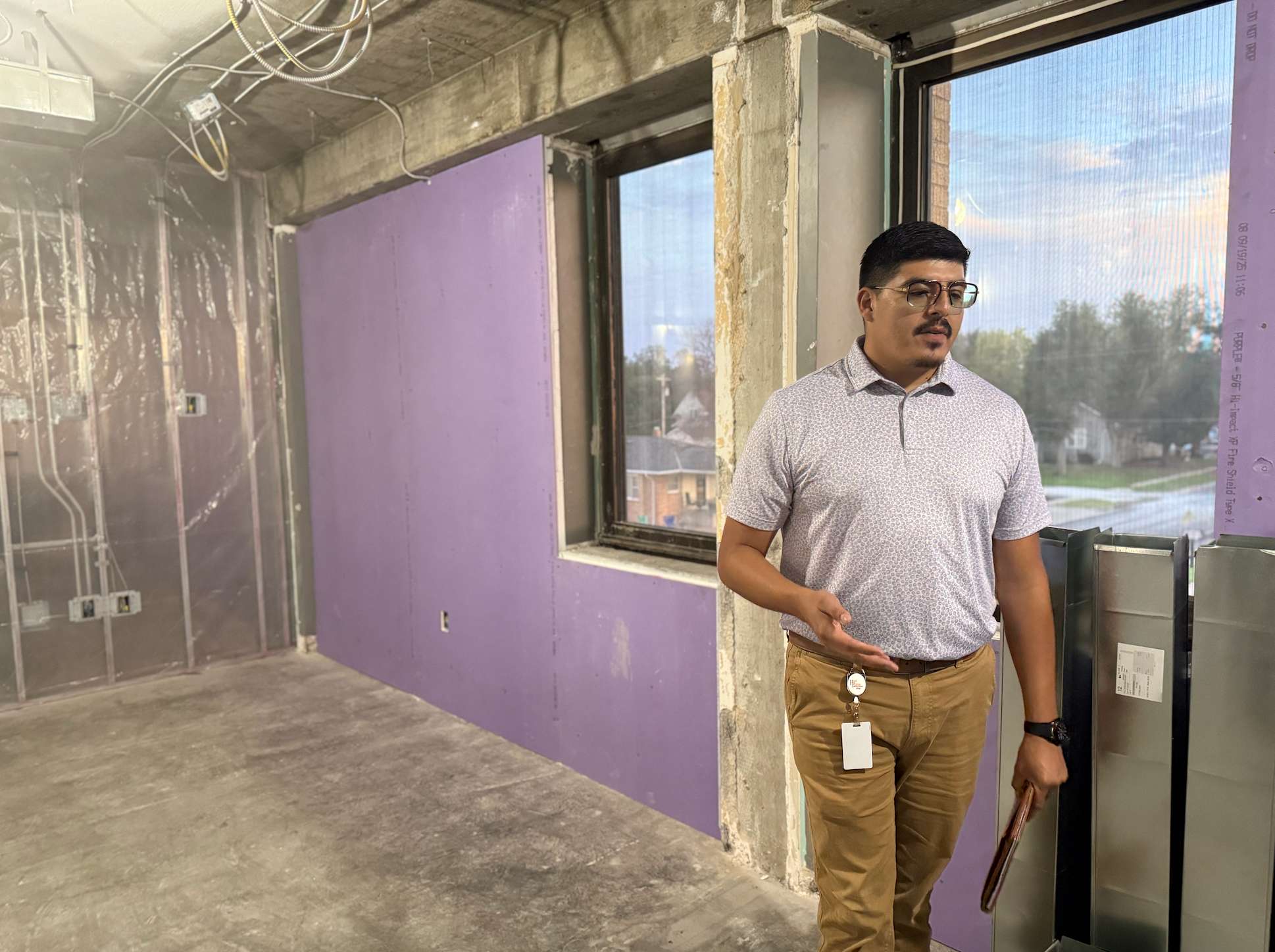 Benito Rivera-Madrid, the center's project manager, discusses the center's operations during a recent tour. He is standing in a future group therapy room. Photo by Cristina Janney/Hays Post