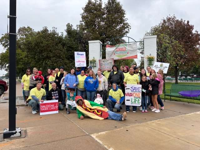 Some of the participants in this year’s Recovery Out Loud gather for a photo at Jack Kilby Square in downtown Great Bend.