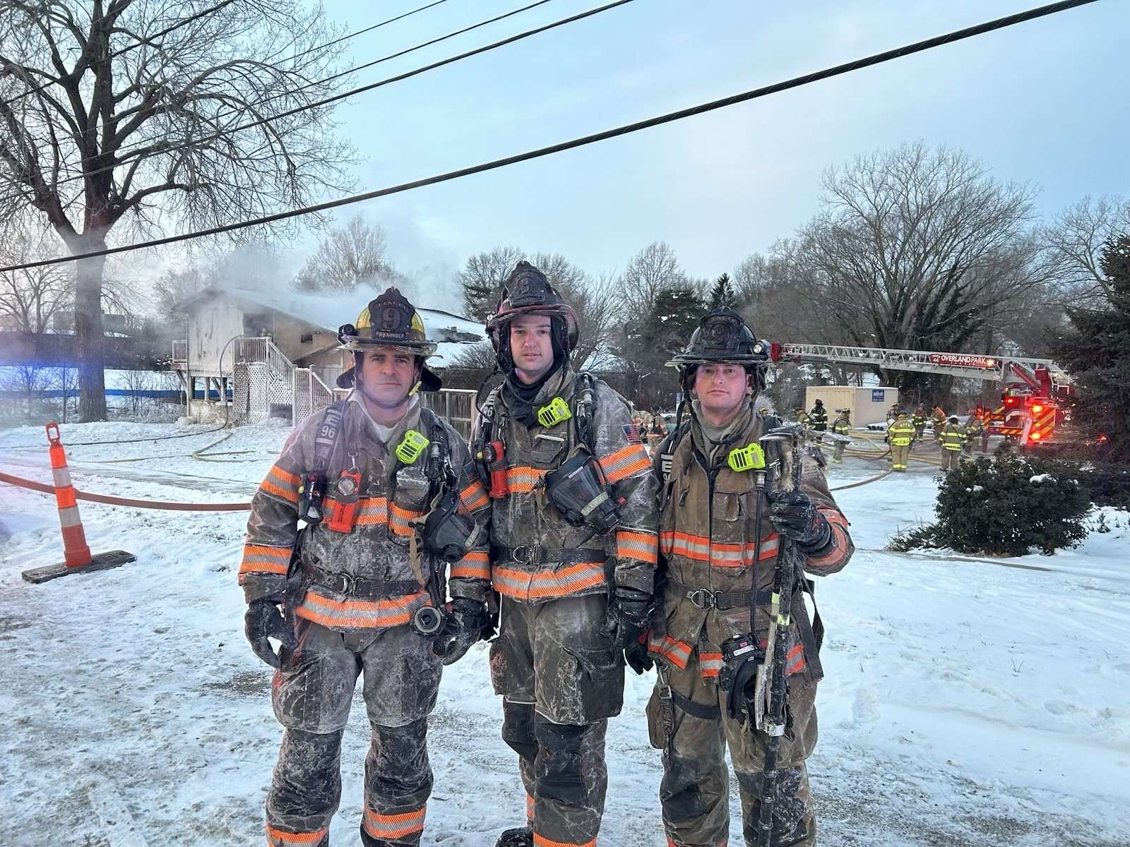 Brandon McKenna, center, pictured with members of the Lenexa Fire Department. Courtesy photo