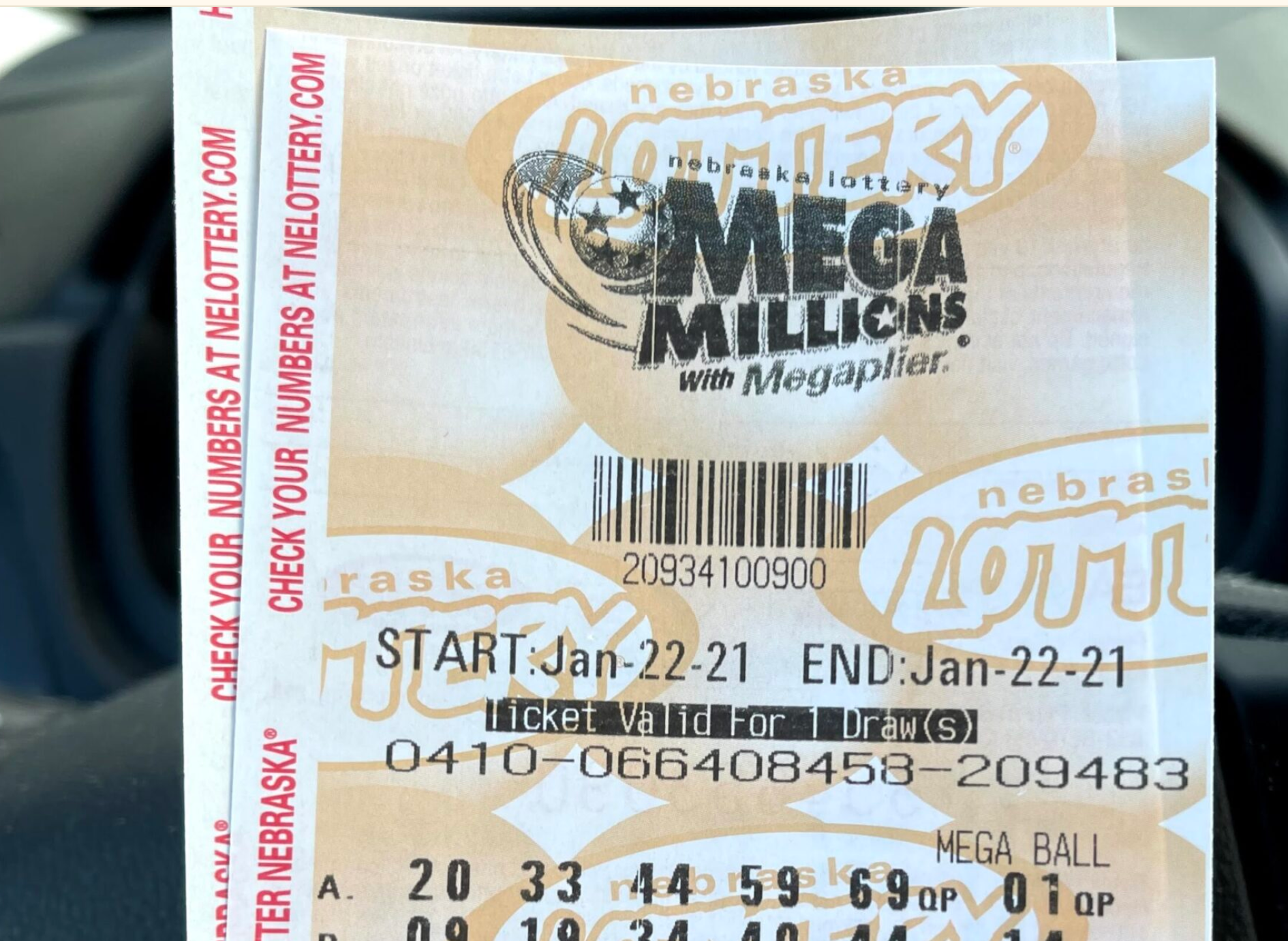 A player holds Nebraska Lottery tickets in his car. (Aaron Sanderford/Nebraska Examiner)