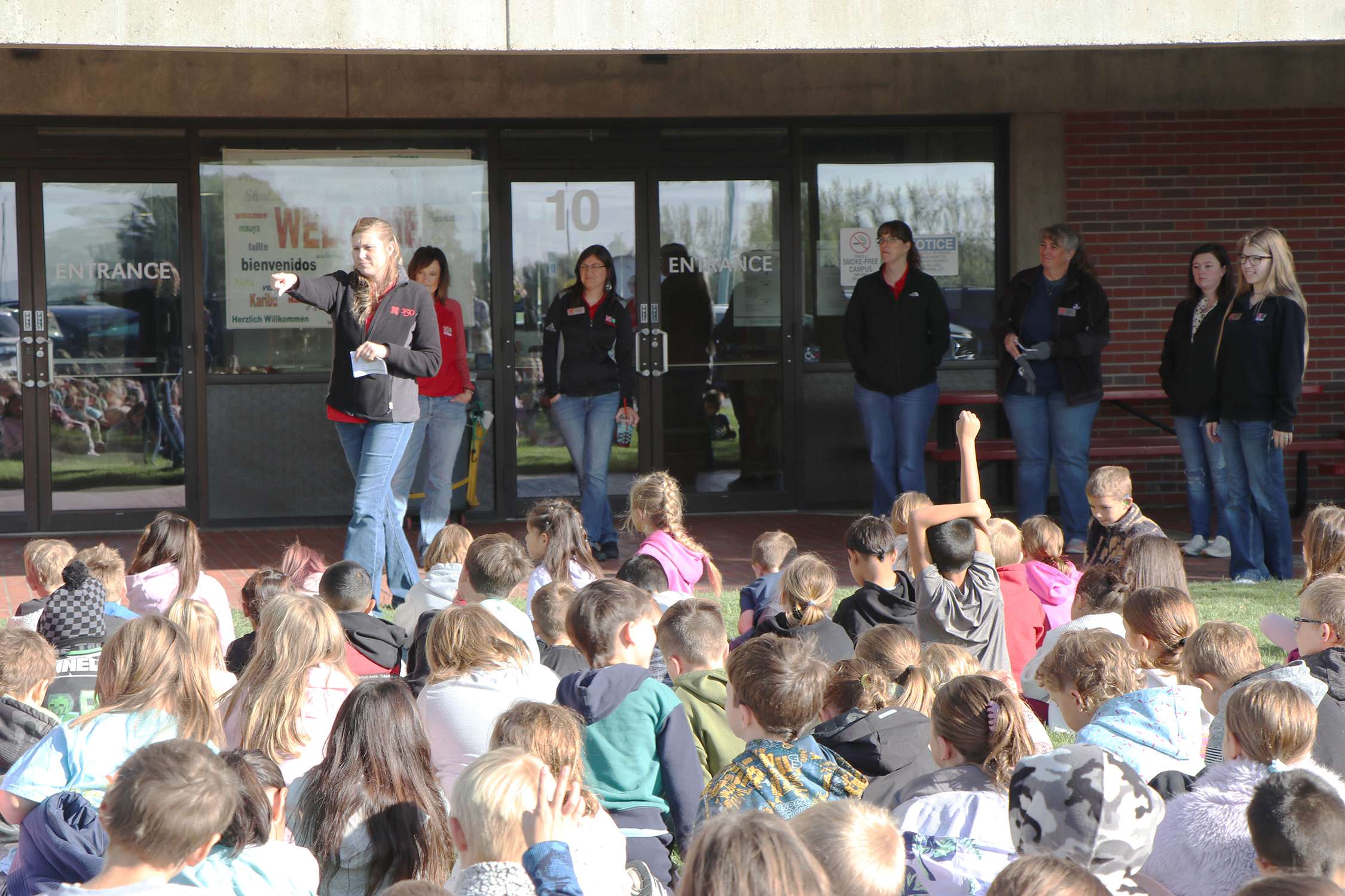 Second graders listen as Nebraska 4-H Extension Educator Melissa Mracek gives directions and takes questions before the beginning of the AgSplosion Field Day. Photo by Chabella Guzman