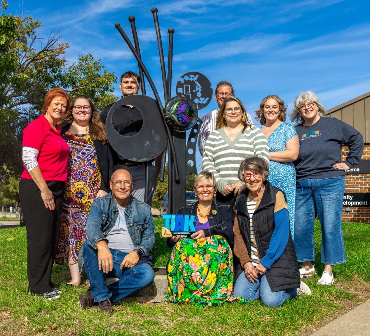 Members of Visit Salina, Salina Arts & Humanities, Salina Downtown and City Commission gather to celebrate 2025 TIAK Award for SculptureTour. Courtesy of Visit Salina