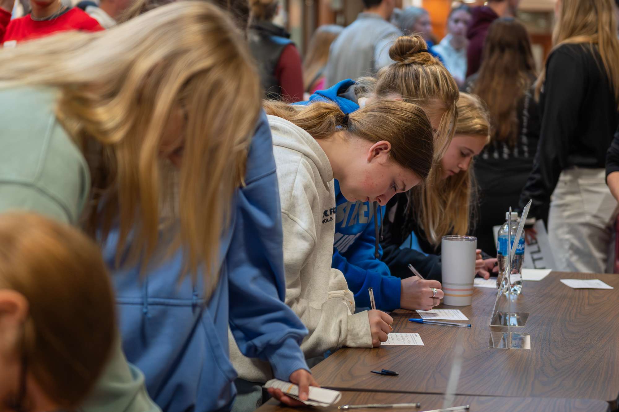 Regional High School students fill out information cards during Scholastic Day in the Student Center, Oct. 15, 2025. (Photo by Sydney Brown/Chadron State College)