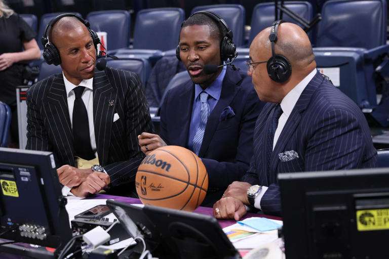 NBA Sports broadcasters, from left, Reggie Miller, Jamal Crawford and Mike Tirico talk after an NBA basketball game between the Houston Rockets and Oklahoma City Thunder, Tuesday, Oct. 21, 2025, in Oklahoma City (AP Photo/Nate Billings)