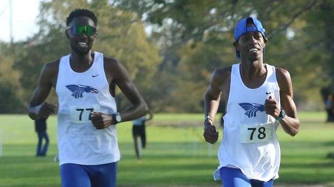 Cornelius Kogo (right) and Titus Kiprotich (left) finish 1-2 individually and lead the No. 2-ranked Blue Dragon men to a second-straight Region 6 Cross Country championship on Friday in Colby. (Photo courtesy Michael Smith)
