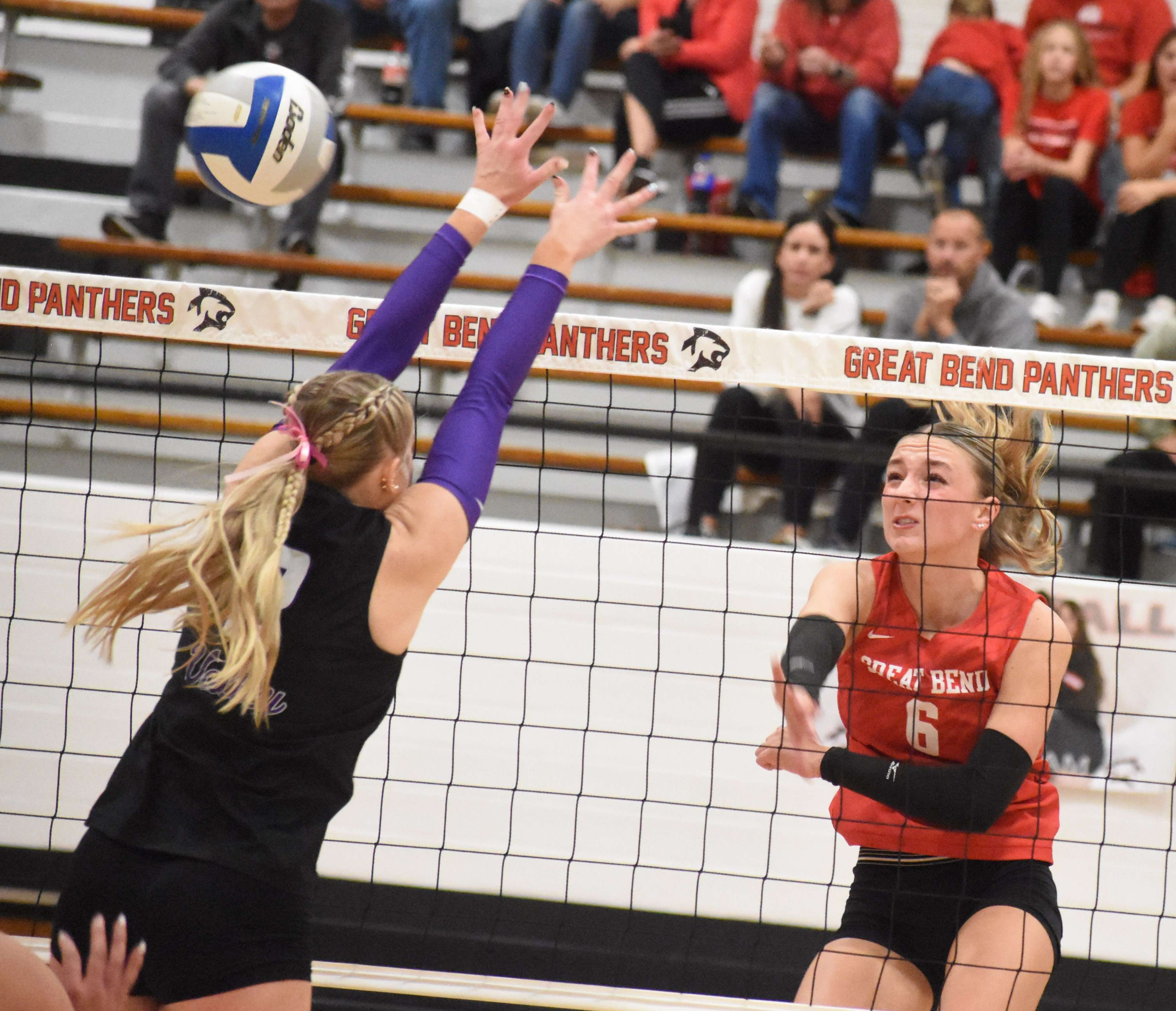 Panther sophomore Mikala Minton gets a hit by a Valley Center defender during the first match of Saturday's sub-state tournament at GBHS.