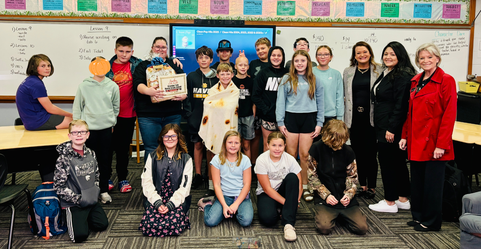 Haven Grade School sixth-grade teacher Brandae Tate, holding the basket, was recognized as the Allen Samuels Chrysler Dodge Jeep Ram Teacher of the Month for October. Tate is pictured with her class and representatives from Allen Samuels and Eagle Media. (Hutch Post Photo)