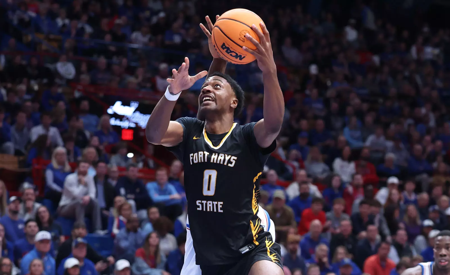 Fort Hays State's Dan Makuna (0) goes in for a layup in and exhibition game against Kansas on Tuesday, October 28, 2025 in Lawrence, Kan. (FHSU Athletics photo/Parker Neibeth)