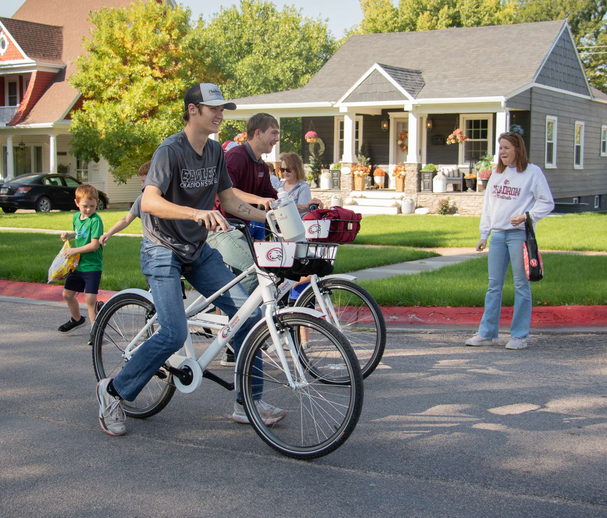 Chadron State College students use bikes from the CSC Wellness Bike Share program during the CSC Homecoming parade on Main Street on Sept, 27, 2025. (Photo by Tena L. Cook/Chadron State College)