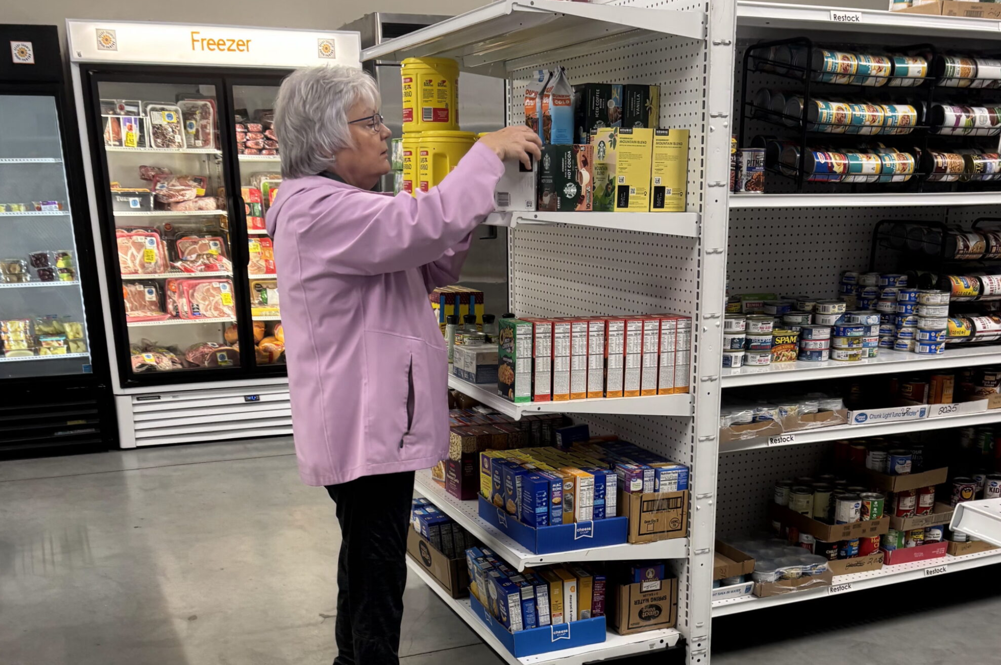 Julia Loper works at the Geary County Food Pantry in Junction City, stocking shelves and helping customers. Like many food pantries across Kansas, the organization is struggling to meet community needs. (Submitted)