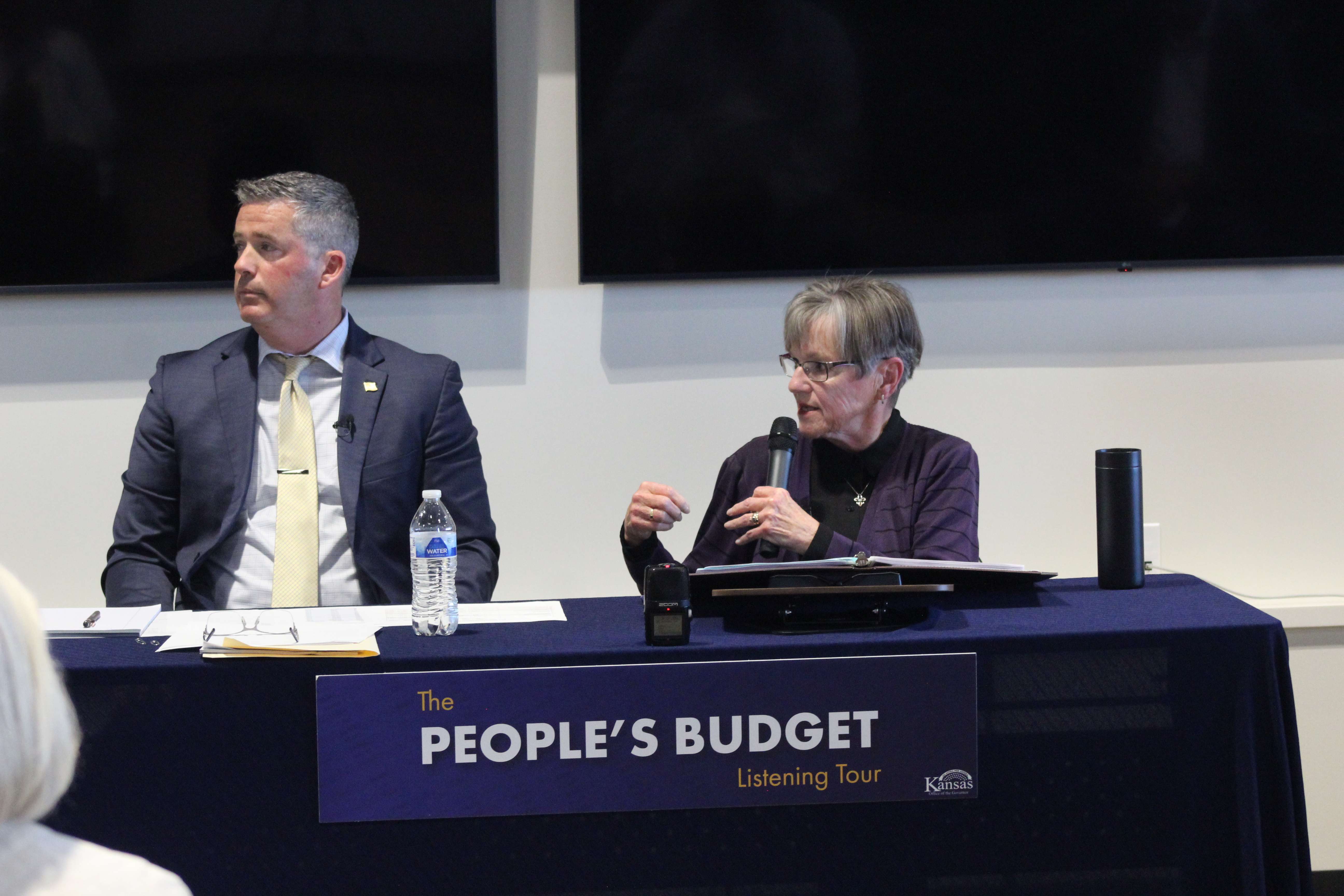 Adam Proffitt, budget director and Secretary of Administration, left, and Gov. Laura Kelly answer residents' questions at a People's Budget Listening Tour stop on Wednesday in Hays. Photo by Cristina Janney/Hays Post