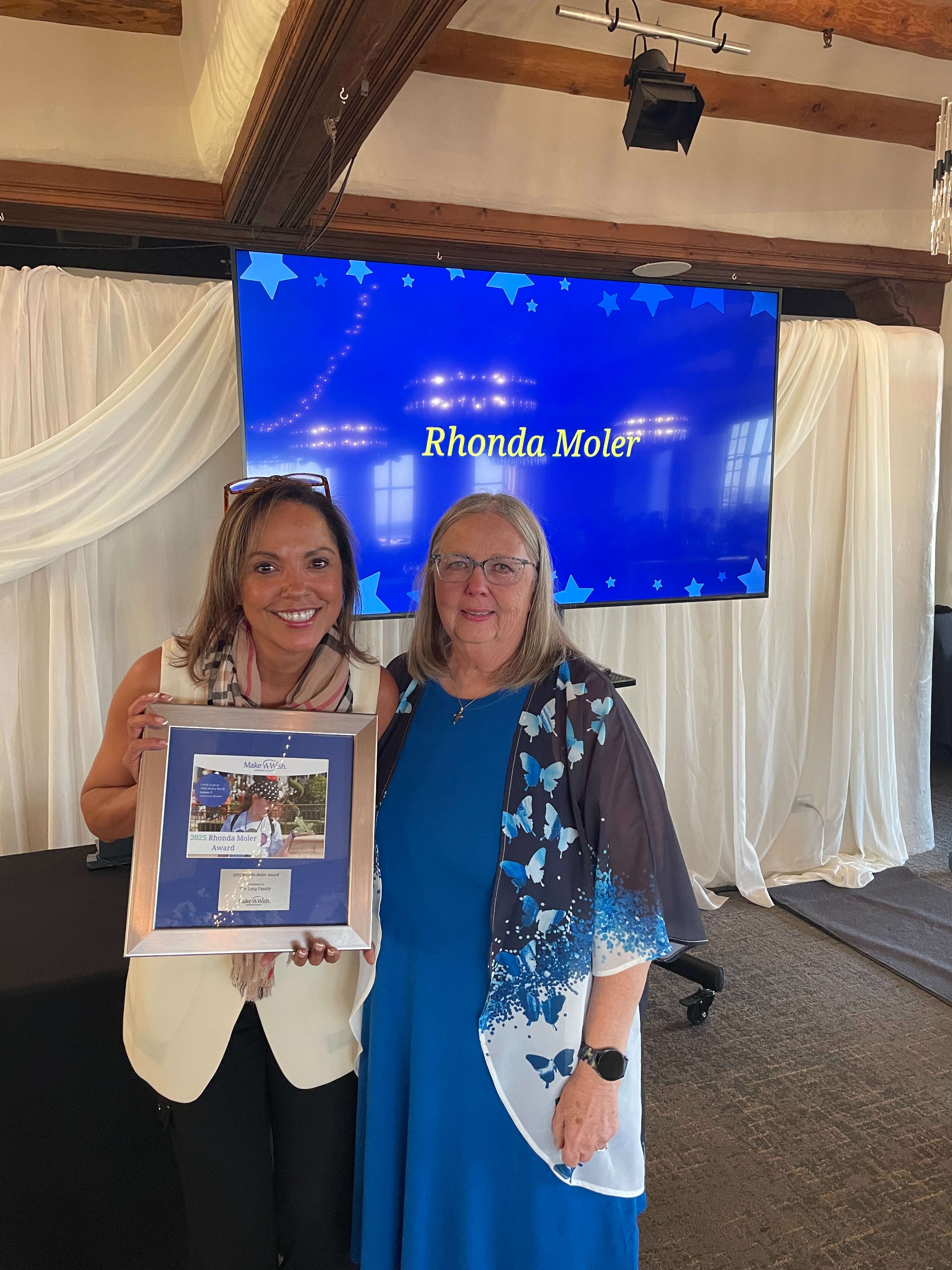 Make-A-Wish Donor Relations Manager CeCe Etter with Jackie Lang after the Lang's received the Rhonda Moler Award - Photos courtesy Thunder on the Plains