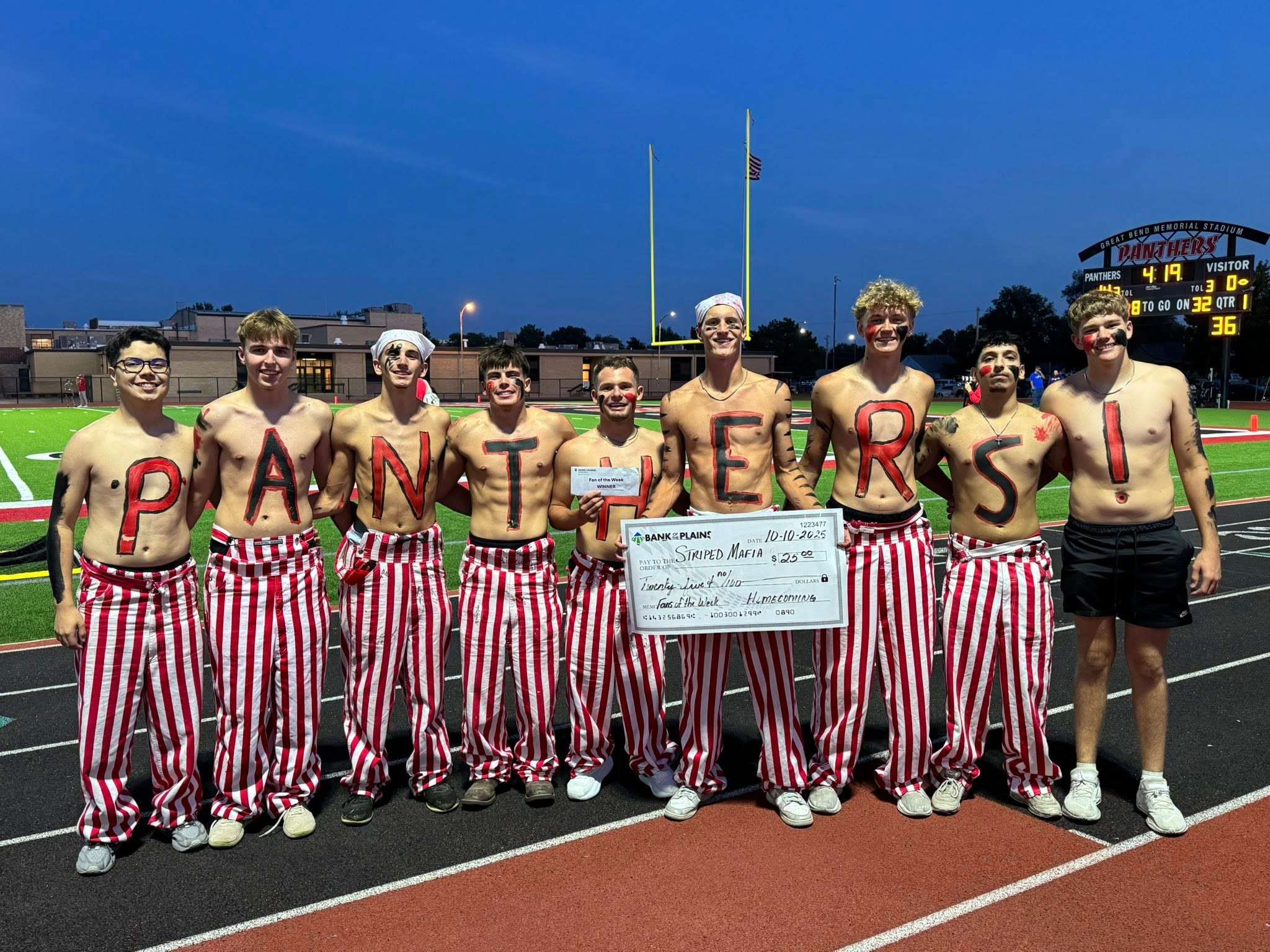 Great Bend High School students started the "Striped Mafia" to support classmates as they compete in various athletic endeavors. (photo by Shelly Duvall)