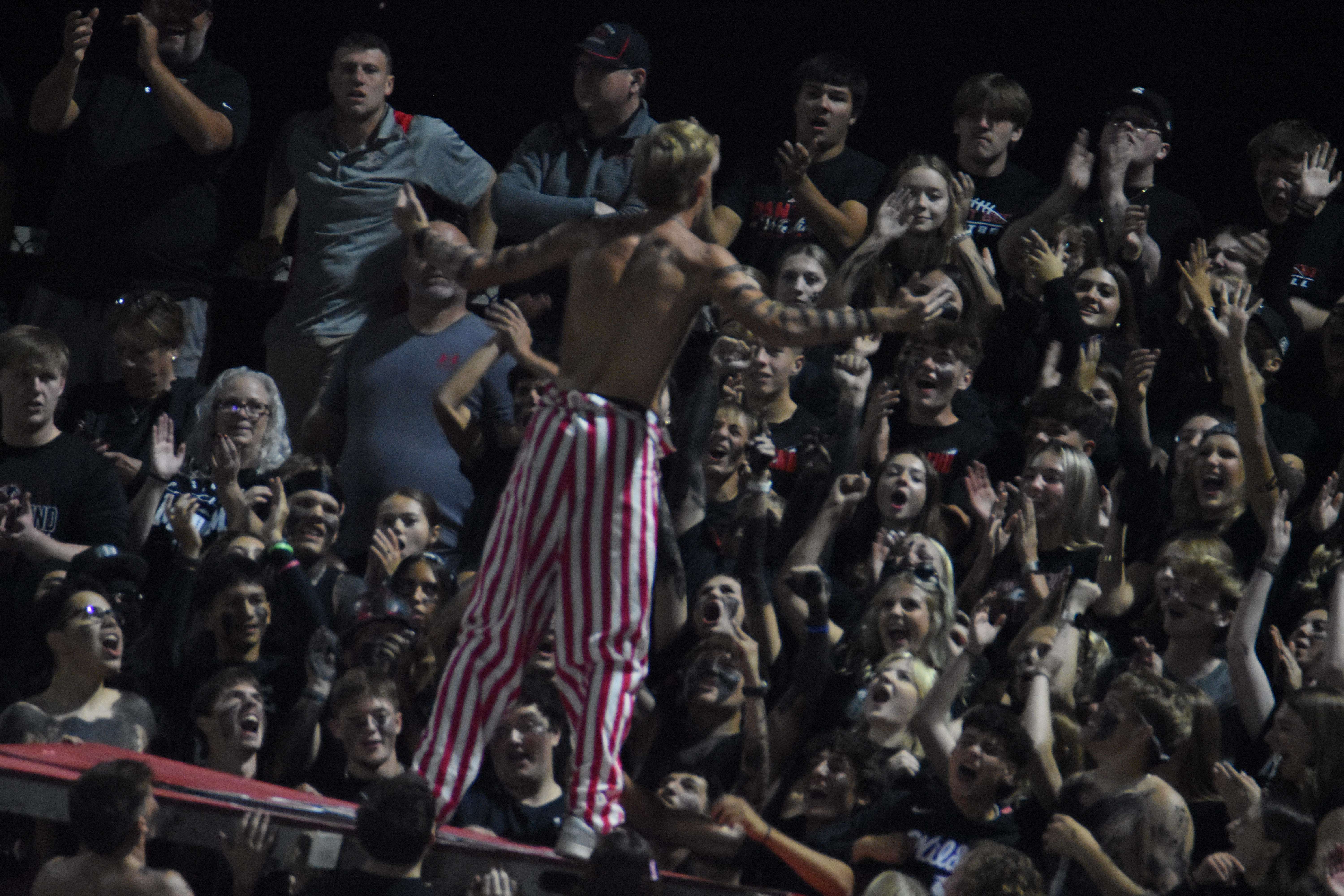 Stroup fires up the crowd in Hays before doing push-ups.