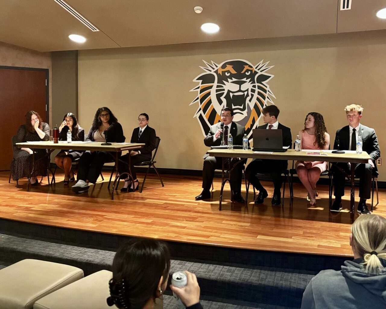 (From left to right) Young Democrats Justice Alexander, Madison Albers, Genesis Wilson, Lillianna Nash and  FHSUCollege Republicans Mickey Mason, Tyler Preisser, Hazel Frans and Daniel Bechle at the annual political debate at Fort Hays State University. Photo by Tony Guerrero/Hays Post