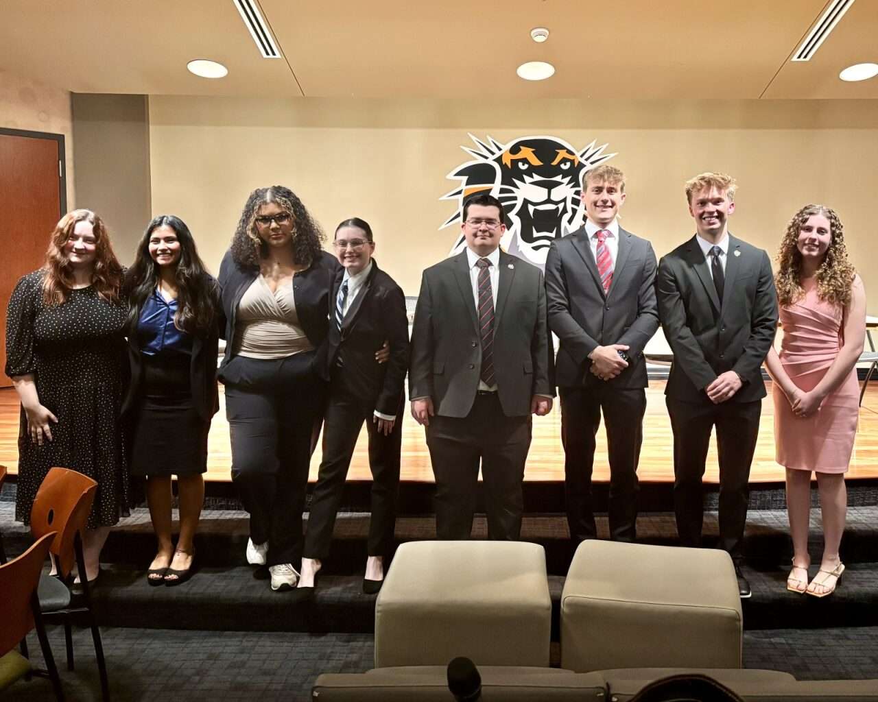 (From left to right) Young Democrats Justice Alexander, Madison Albers, Genesis Wilson, Lillianna Nash and College Republicans Mickey Mason, Tyler Preisser, Daniel Bechle and Hazel Frans at the annual political debate at Fort Hays State University. Photo by Tony Guerrero/Hays Post