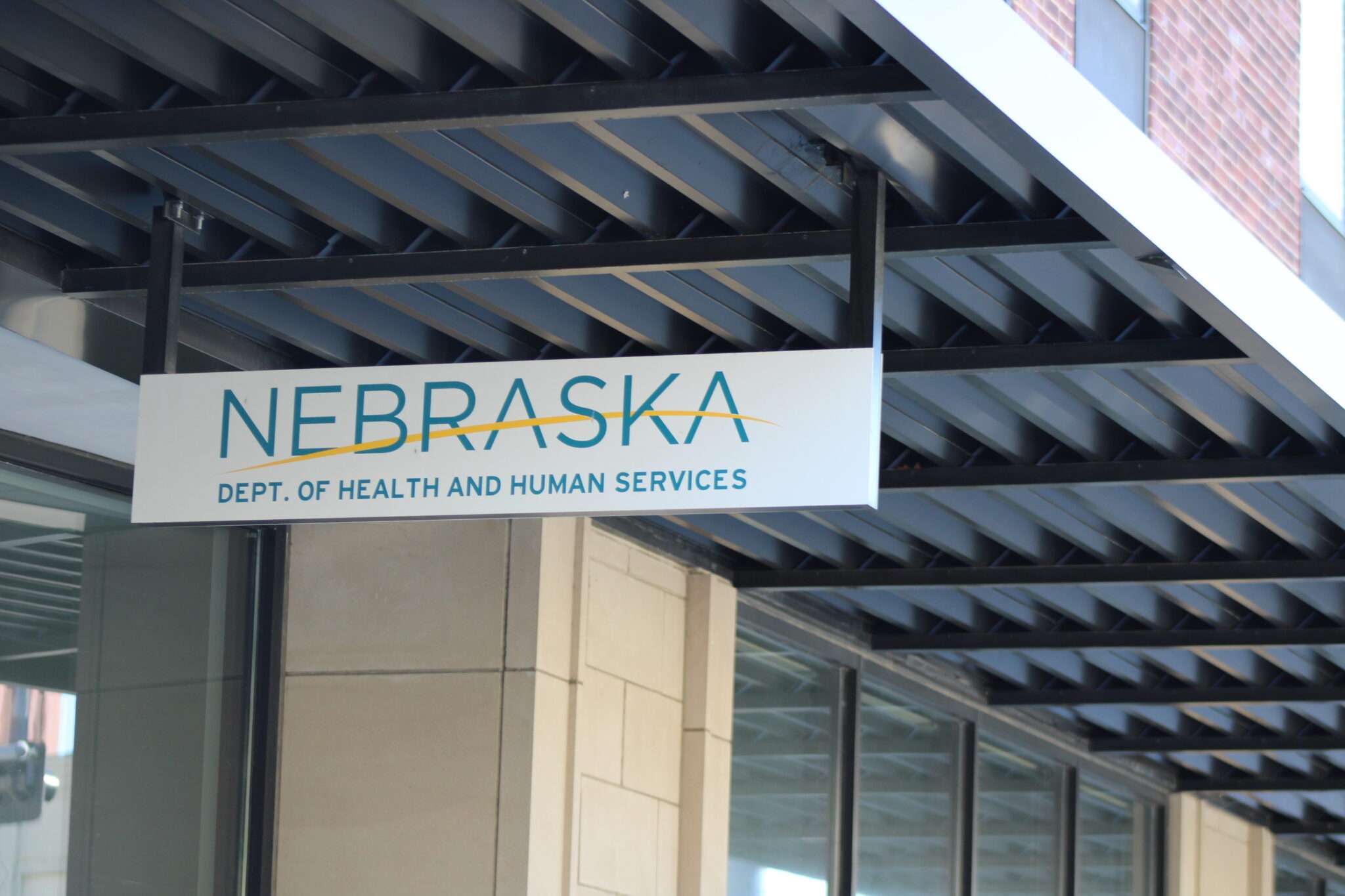 A sign in front of the Nebraska Department of Health and Human Services' Lincoln Public Assistance Office on Oct. 30, 2025. (Juan Salinas II/Nebraska Examiner)