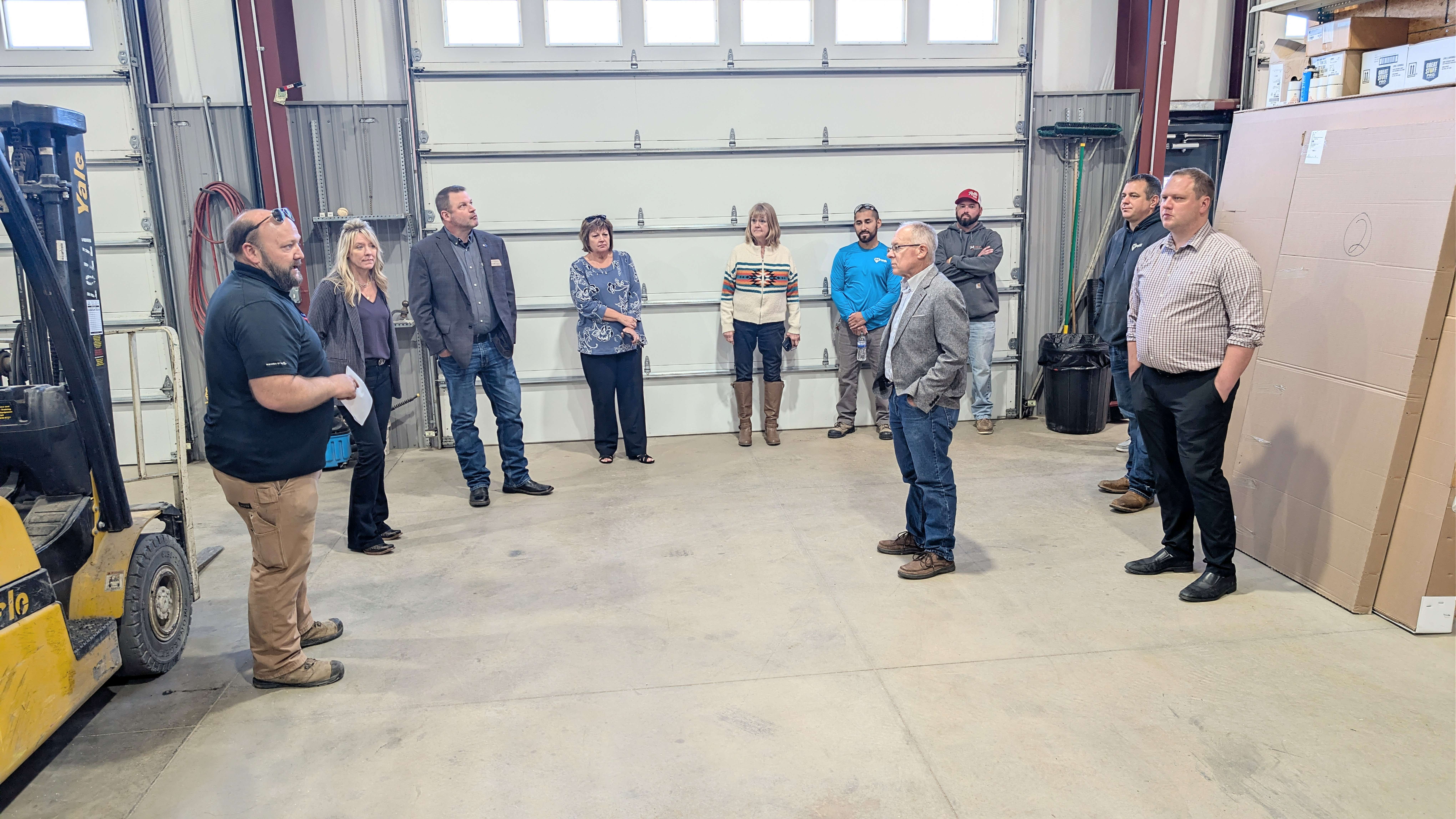 Barton County commissioners and other county officials continue their Travel 389 visits Tuesday afternoon by making stops at MPIRE Improvements and Overhead Door.