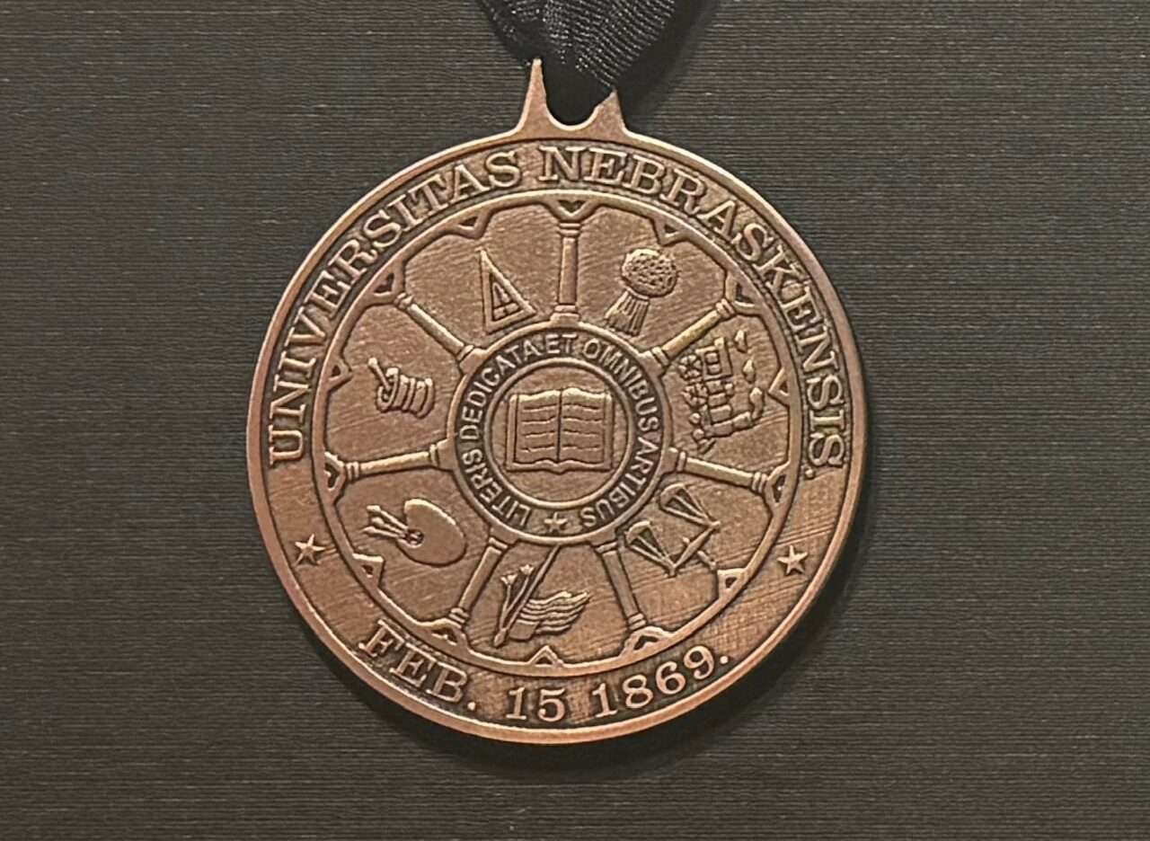 The NU Regents Medal, described as the most prestigious award granted by the University of Nebraska, was given recently to two former NU coaches. (Paul Hammel/Nebraska Examiner)
