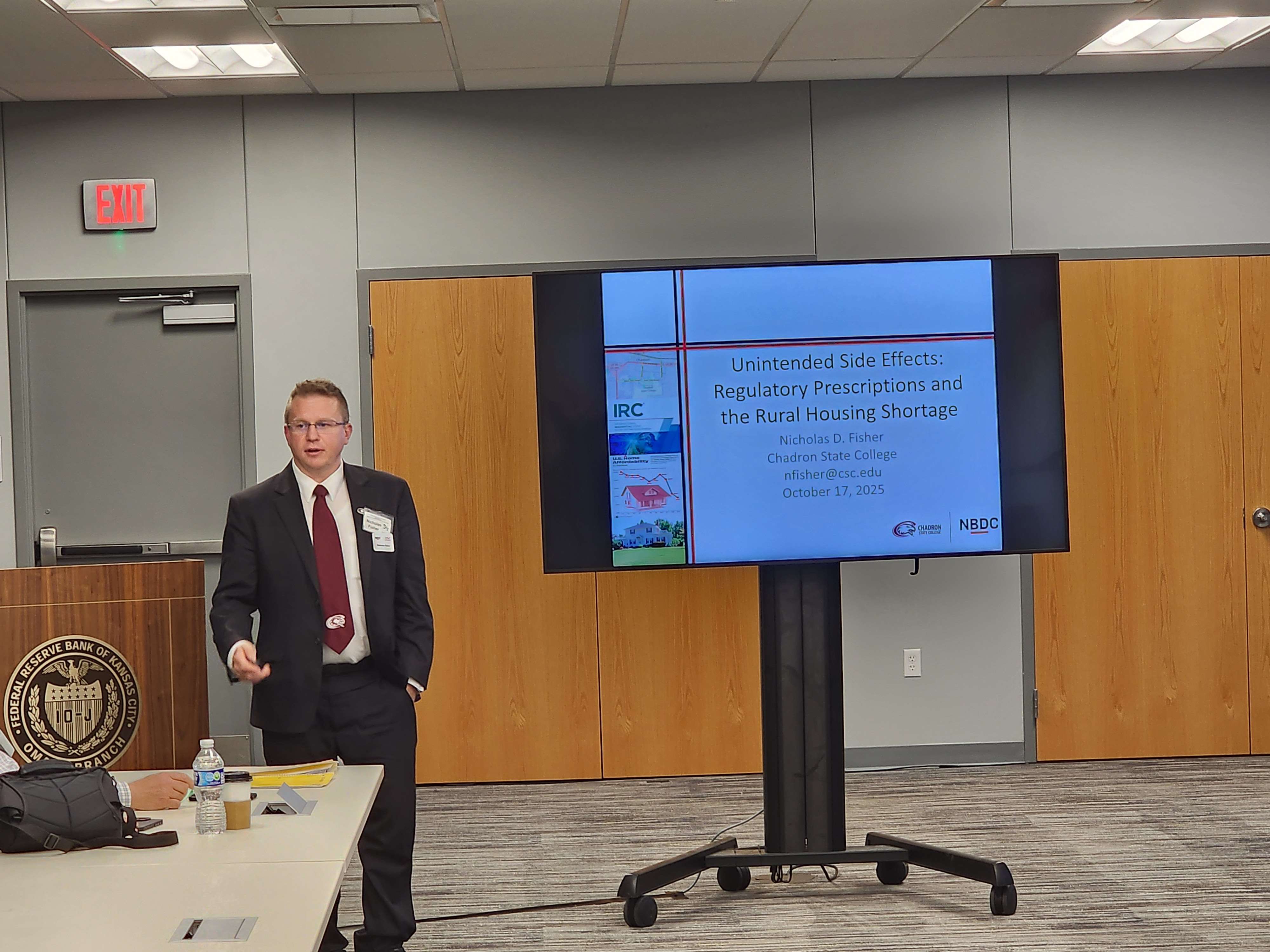 Dr. Nic Fisher, Assistant Professor of Business at Chadron State College, makes a presentation titled Unintended Side Effects: Regulatory Prescriptions at the Great Plains Economics and Business Conference in Omaha Oct. 17, 2025. (Courtesy photo, used with permission)