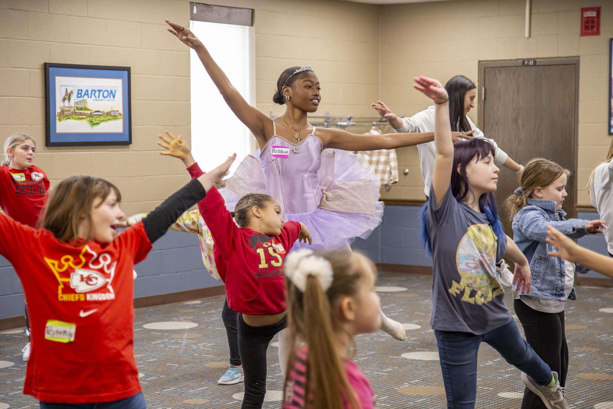Attendees practice a dance at a prior "Fairytale Creative Camp" event.