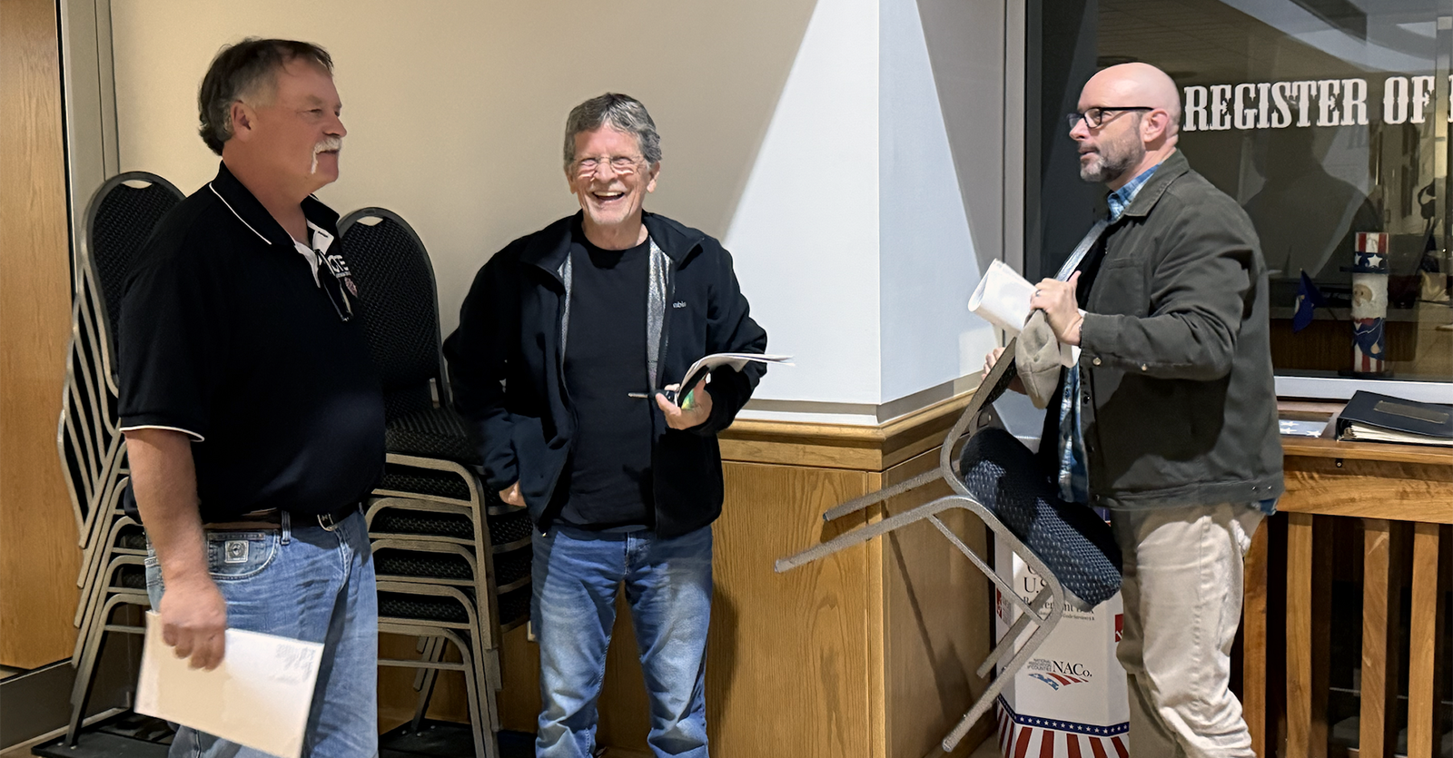 From left: candidates Curt Vajnar, Craig Pallister and Ken Brooks at the Ellis County Administrative Center Tuesday night after learning they won seats on the Hays USD 489 school board. Photo by Cristina Janney/Hays Post