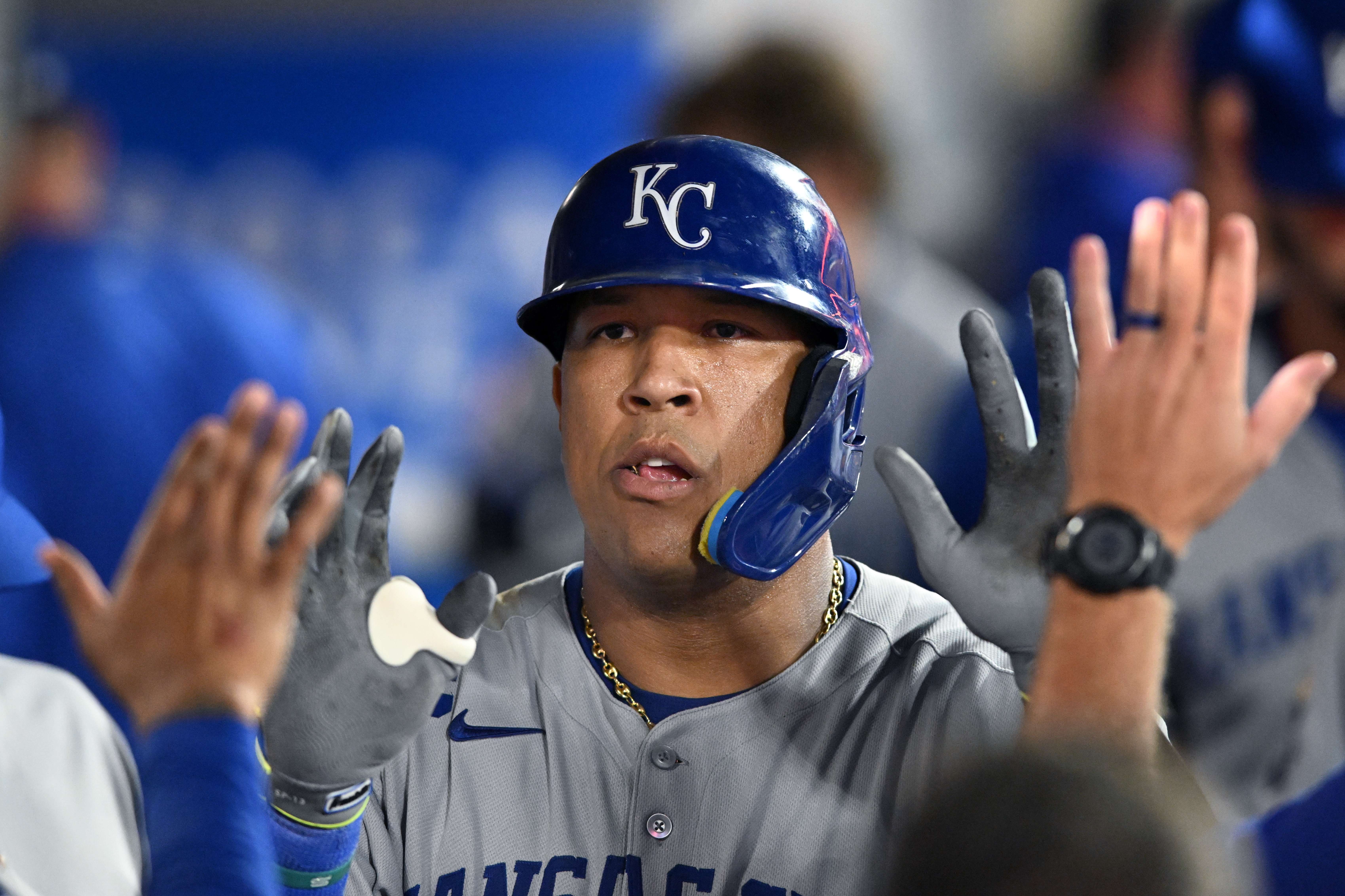 FILE - Kansas City Royals Salvador Perez celebrates in the dugout after scoring a run against the Los Angeles Angels in the ninth inning of a baseball game Sept. 25, 2025, in Anaheim, Calif. (AP Photo/Wally Skalij, File)