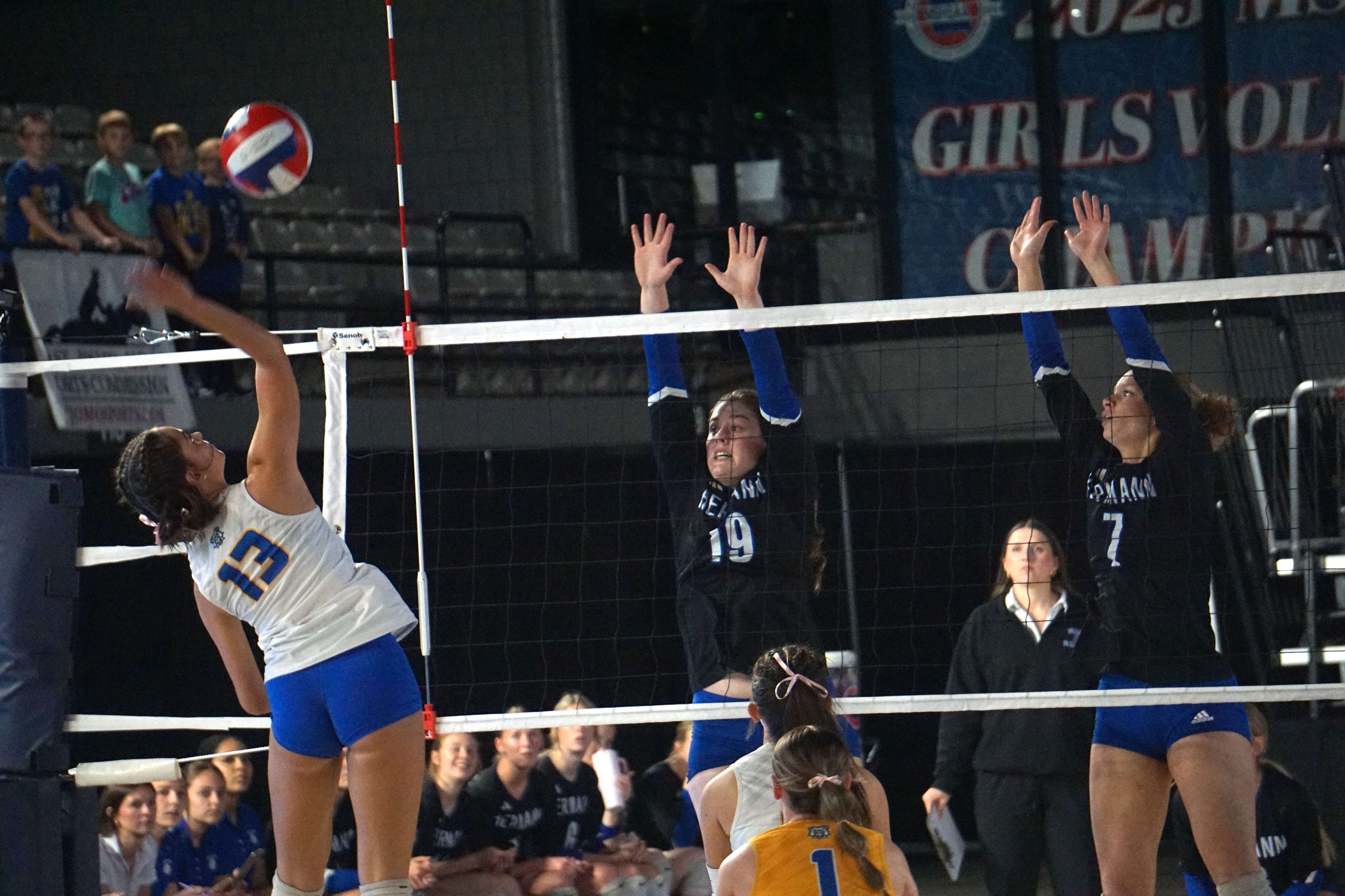 Layla Watkins (13) attempts to put the ball past Hermann defenders Madyson Yates (19) and Ashlyn Hughes (7)/ Photo by Matt Pike