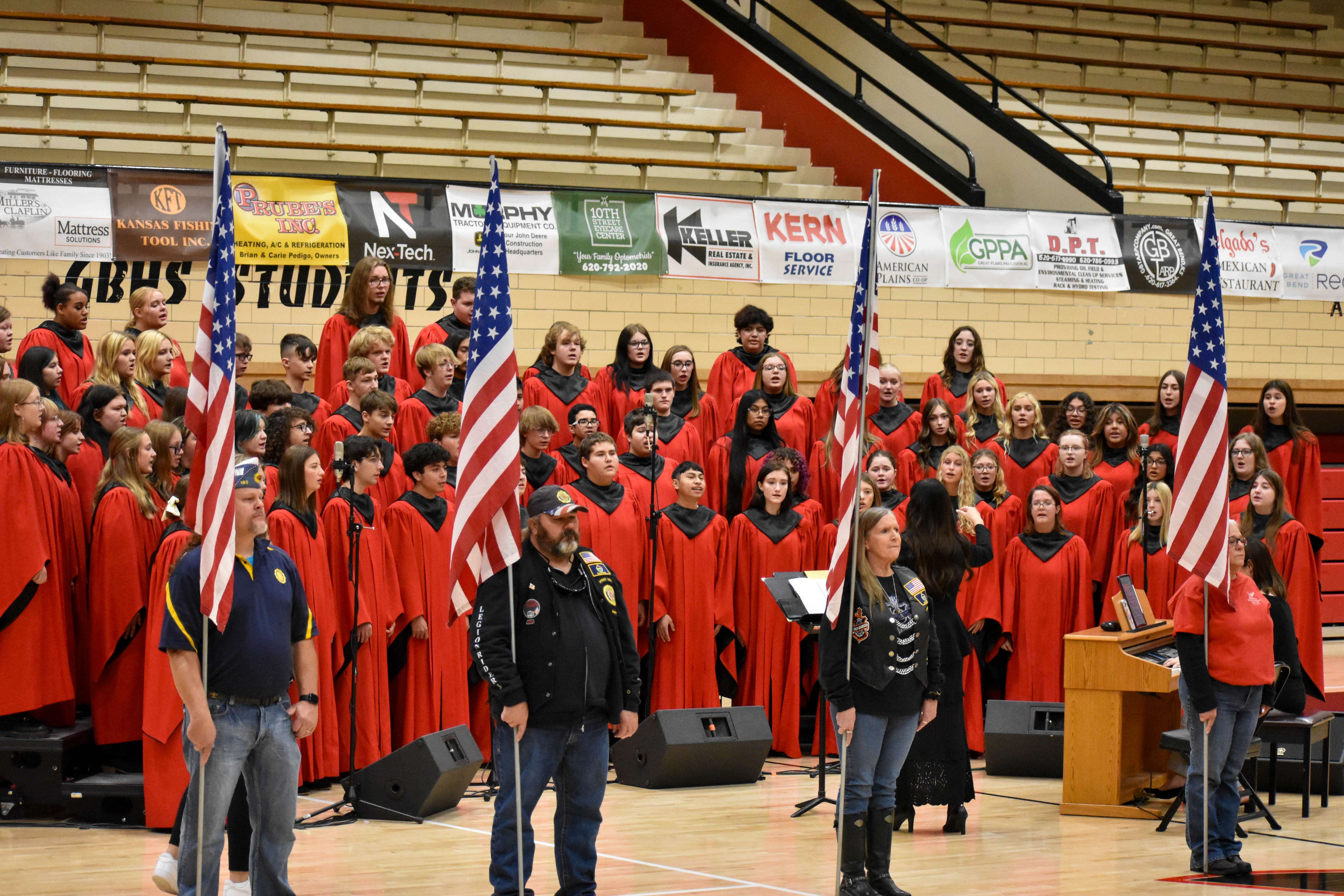 Legion Riders present the American Flag in front of the GBHS Acapella Choir at the 2024 Veterans Day Assembly.
