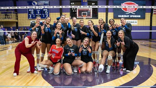 The Blue Dragon volleyball team celebrates a reverse sweep of the Butler Grizzlies, winning 15-13 in the fifth set, in the opening round of the Region 6 Volleyball Tournament on Wednesday in El Dorado. (Phot courtesy Ed Bailey)