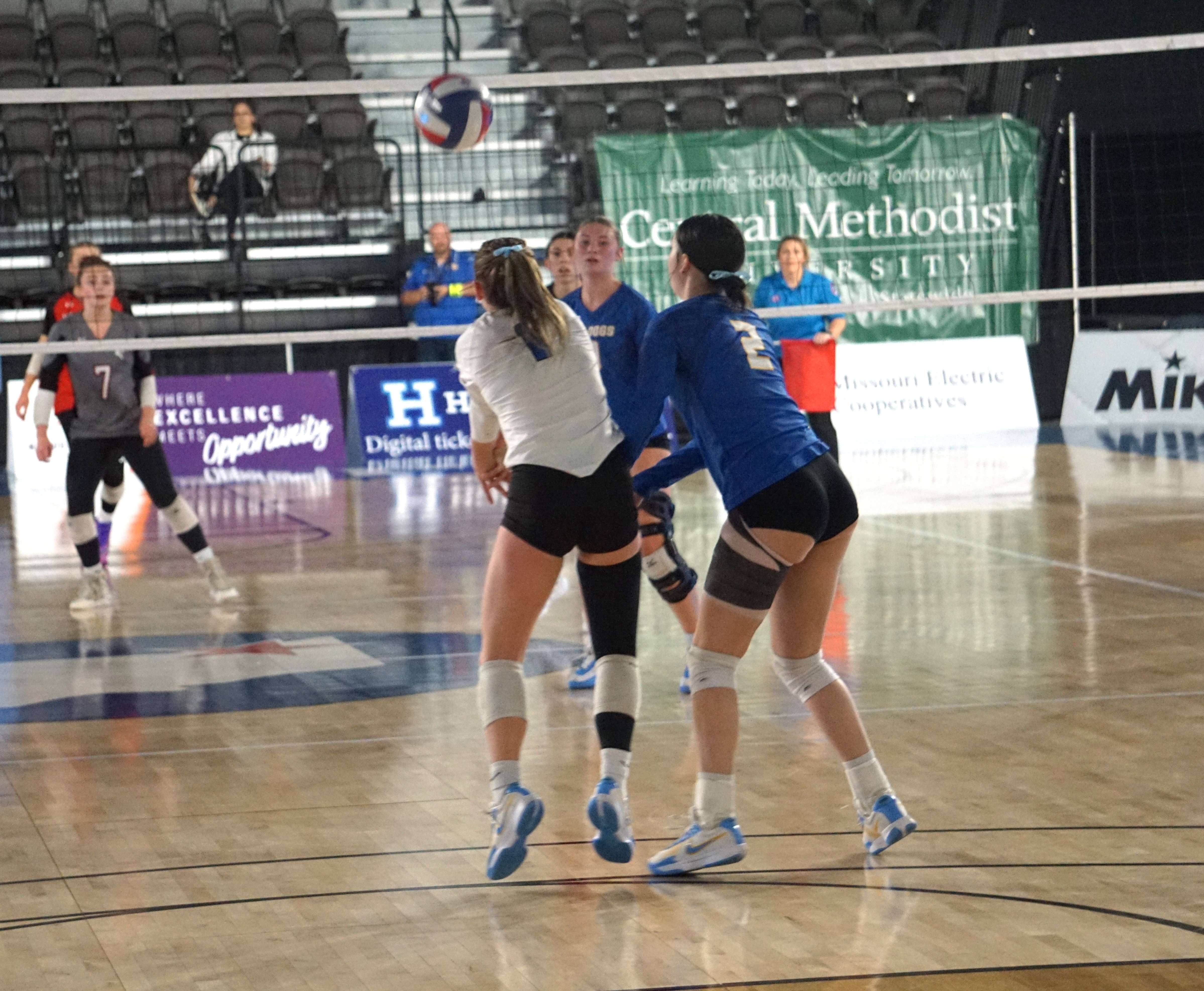 Senior Libero Kaylnn Engnes (1) and Junior Piper Jacobs (2) go for the bump to set up a shot for East Buchanan/ Photo by Matt Pike