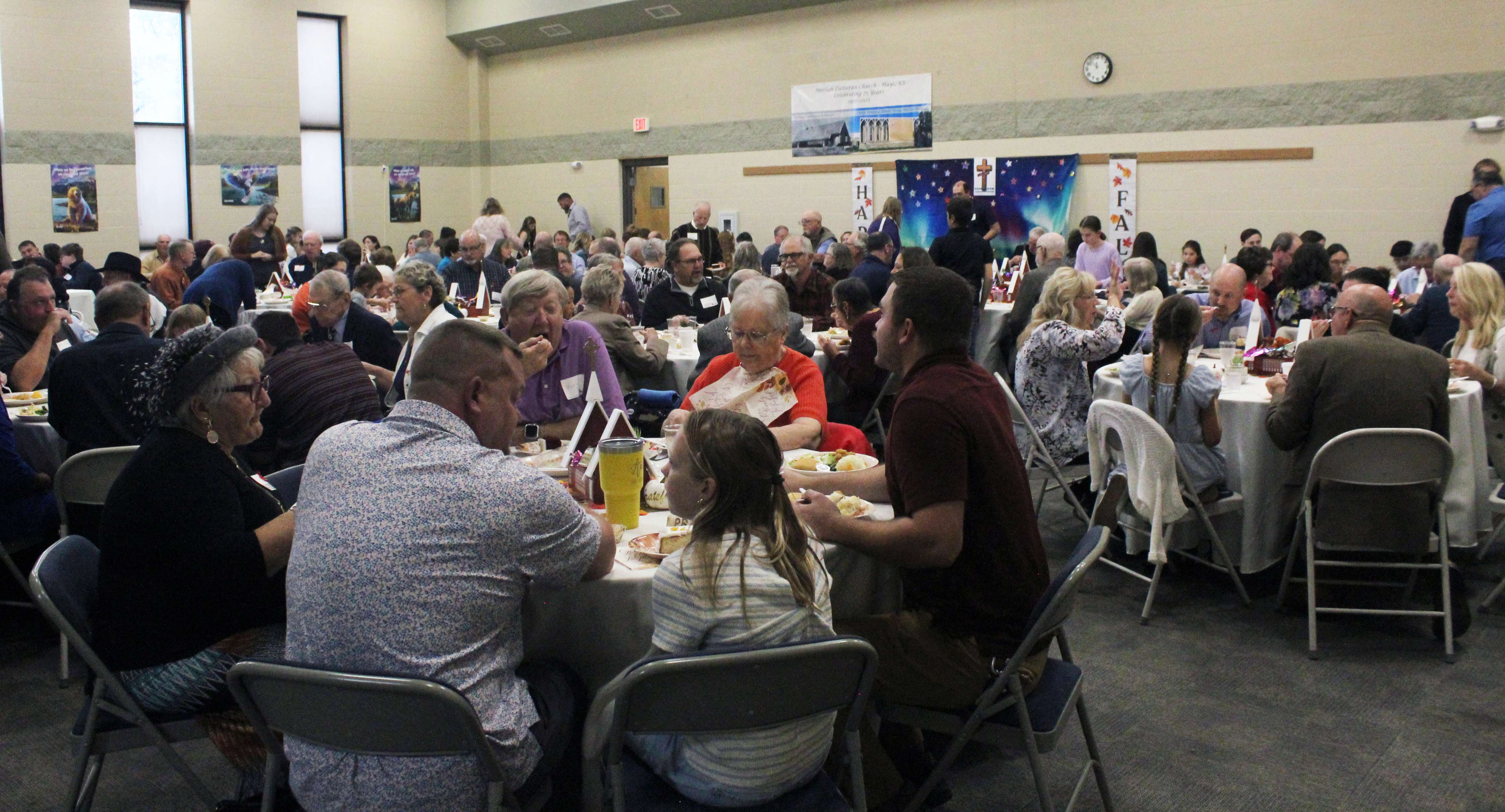 Congregation members join in a catered lunch on Oct. 26 to celebrate the church's 75th anniversary. Photo by Cristina Janney/Hays Post