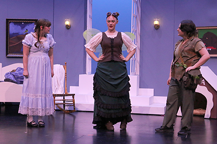 Wendy (senior Rose Windholz) reacts to a remark from the jealous Tinkerbell (sophomore Ella Fenwick) as Peter Pan (junior Riley Flax) stares in disbelief.&nbsp;Courtesy photo