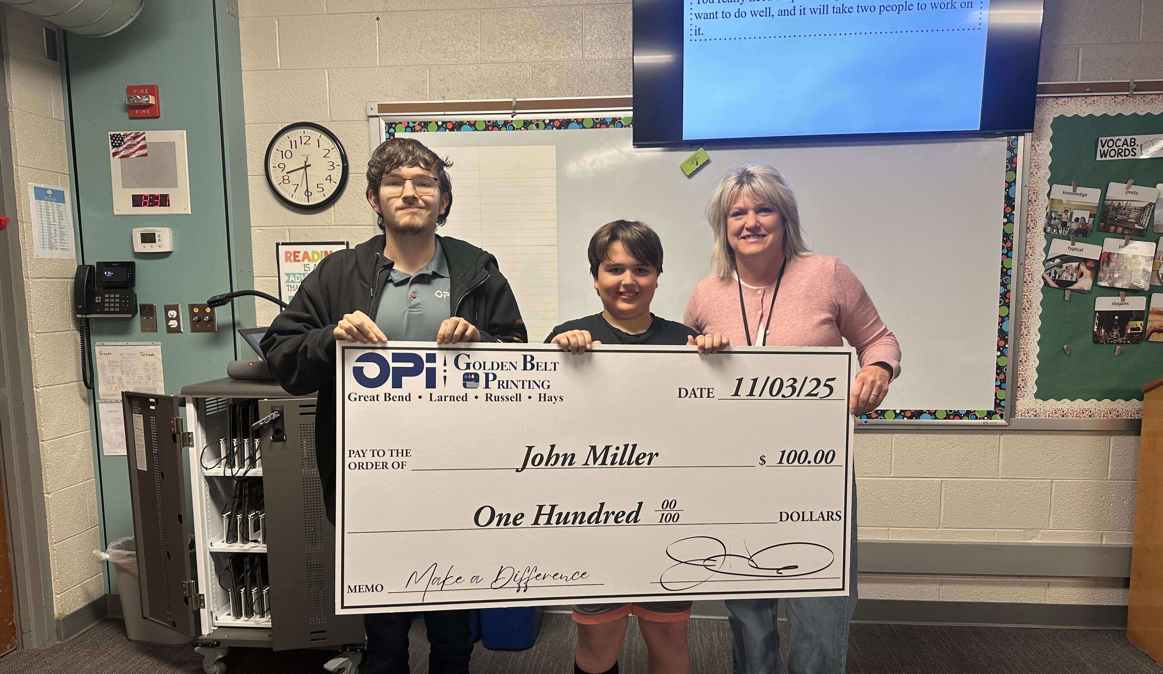 John Miller, a fifth grader at Jefferson Elementary in Great Bend, was presented a $100 check from OPI & Golden Belt Printing after being selected as the first Make a Difference Contest winner in November. John and his teacher, Ms. Miller, are now eligible for prizes in the monthly drawing.