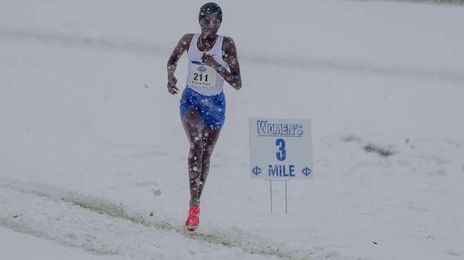 Running in 2 inches of snow and 29-degree temperatures, Blue Dragon freshman Mildred Rono won the 2025 NJCAA Division I individual national championship on Saturday in Fort Dodge, Iowa. (Photo by Ed Bailey)
