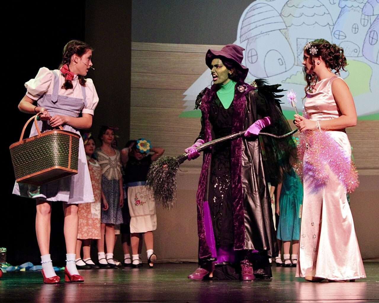 Grace Schmeidler as Dorothy Gale,&nbsp;Morgan Greenwood as the Wicked Witch of the West and&nbsp;Kendall Seiler as Glinda. Photo by Tony Guerrero/Hays Post