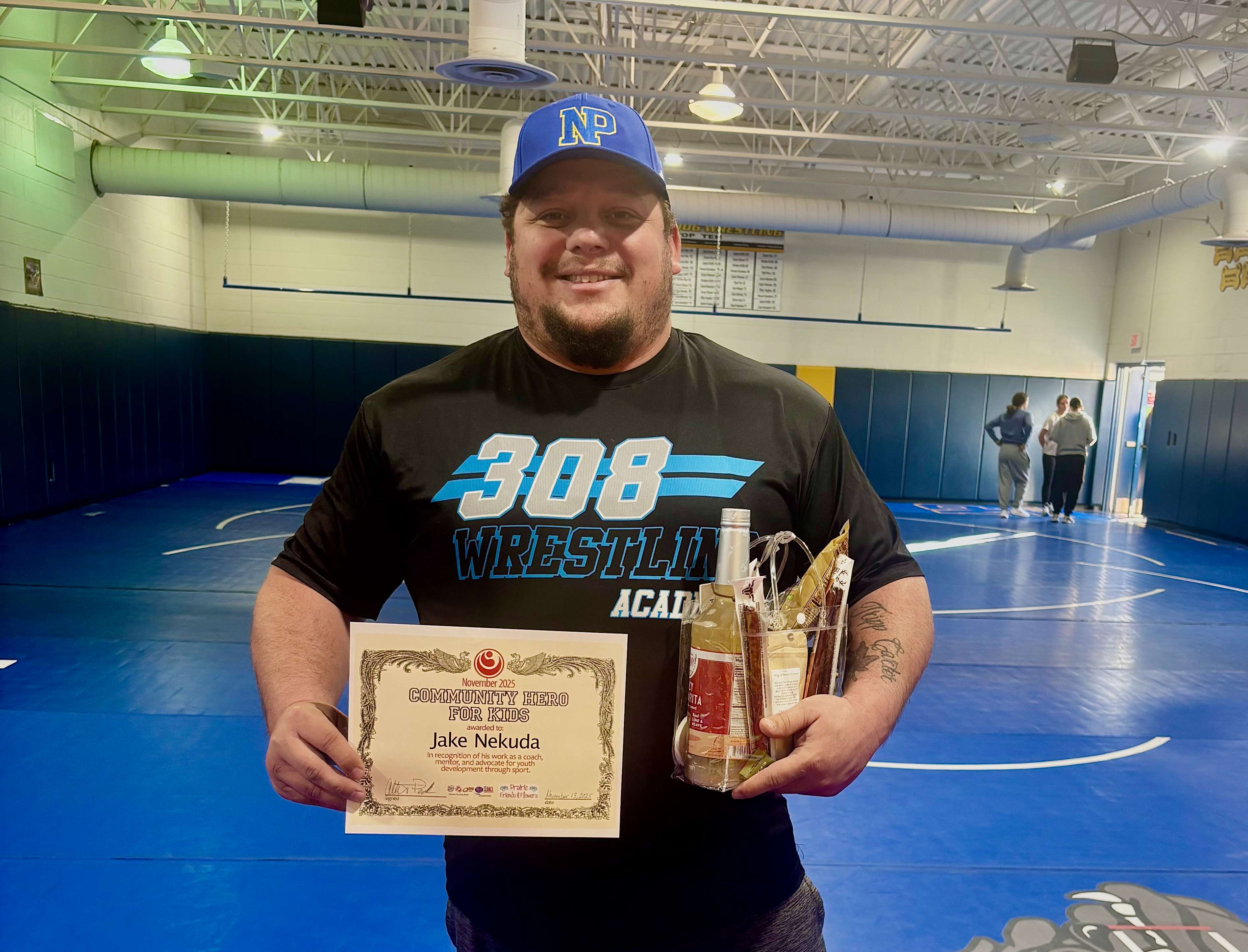 This months Community Hero for Kids sponsored by Prairie Friends & Flowers, is Jake Nekuda with 308 Wrestling Academy.