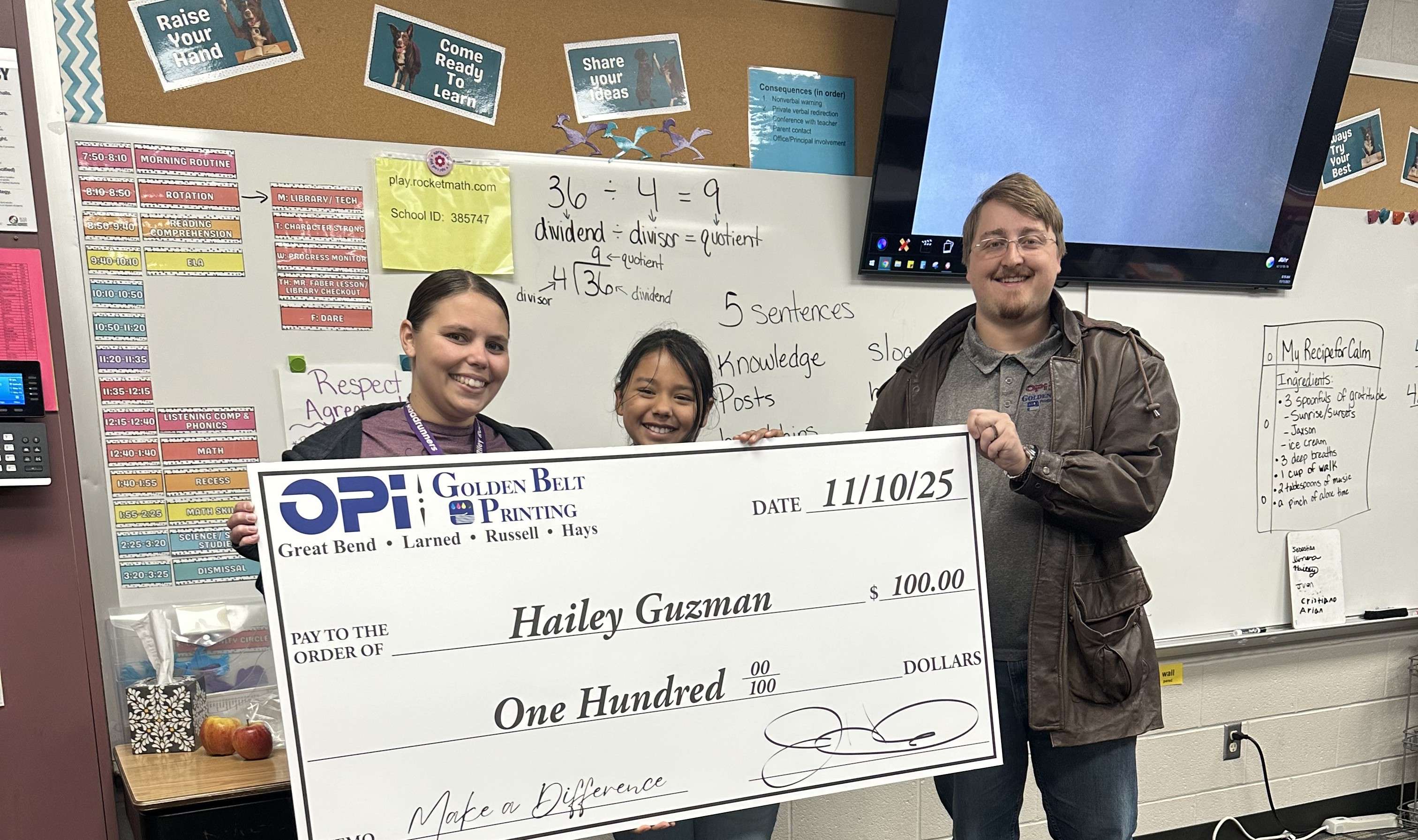 OPI &amp; Golden Belt Printing presented Riley Elementary fifth-grader Hailey Guzman with a giant $100 check as the latest winner in Eagle Media's Make a Difference Contest. As a weekly winner, Guzman and her teacher, Mandy Stansfield, are now eligible for a monthly prize.