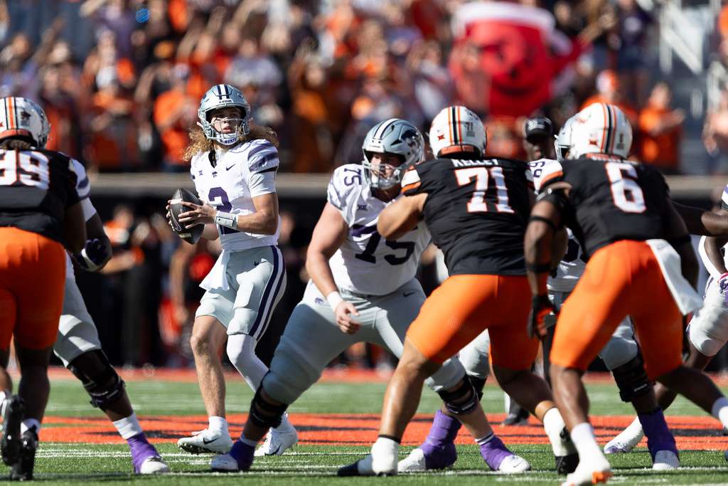 Kansas State quarterback Avery Johnson (2) drops back to pass in the first half of NCAA college football game against Oklahoma State Saturday, Nov. 15, 2025, in Stillwater, Okla. (AP Photo/Mitch Alcala)