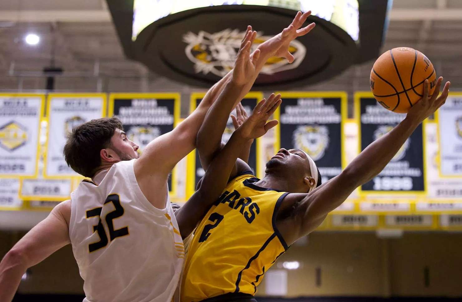 Fort Hays State's Eli Lawson (32) defends a shot from Concordia-St. Paul's Marcus Burks (2) in the first half of their college basketball game on Sunday, November 16, 2025 in Hays, Kan. (FHSU Athletics photo/Jordyn Bredenberg)