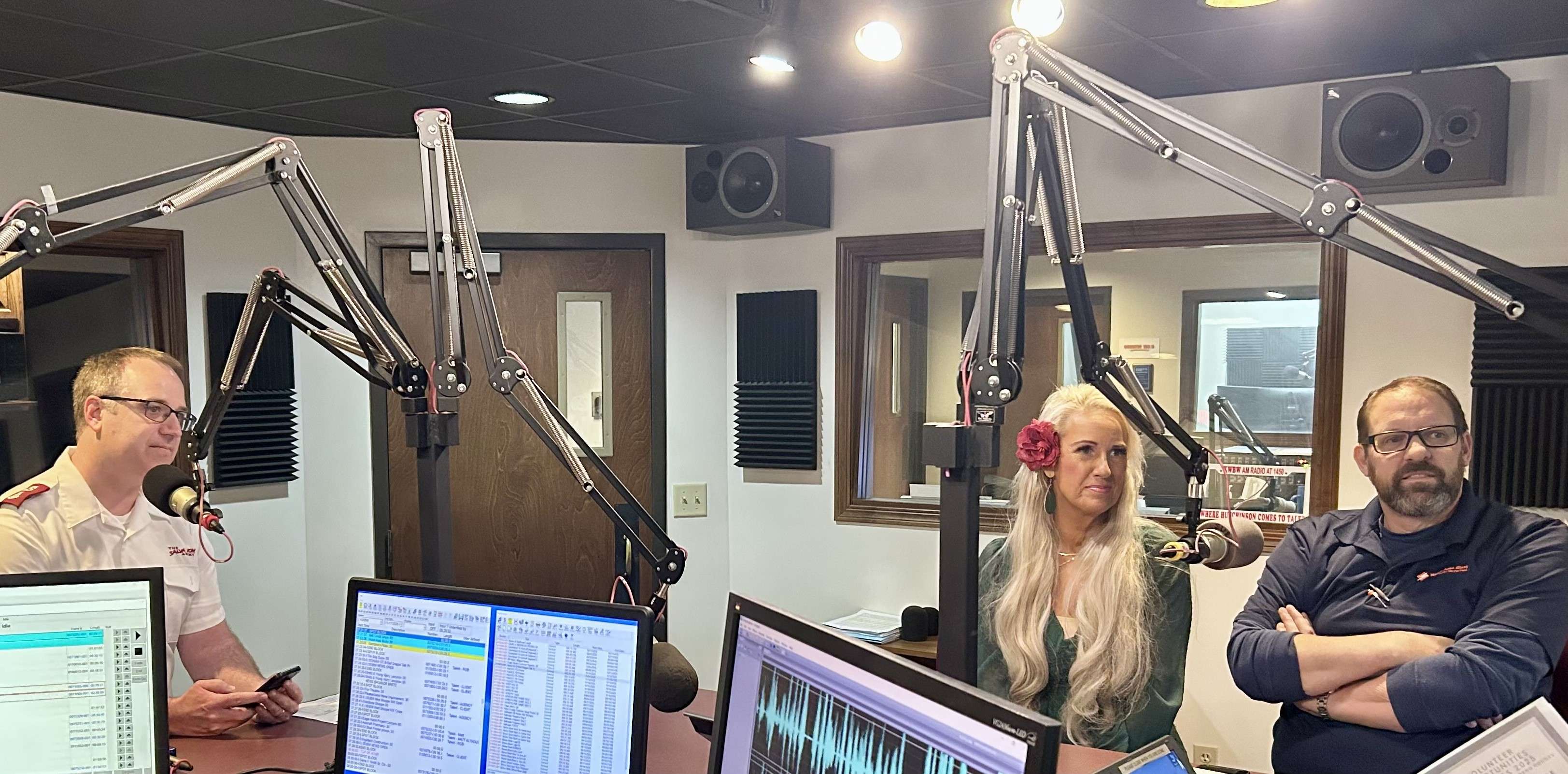 Maj. Paul James (L) and Christena and David Weber, Salvation Army Red Kettle Campaign 