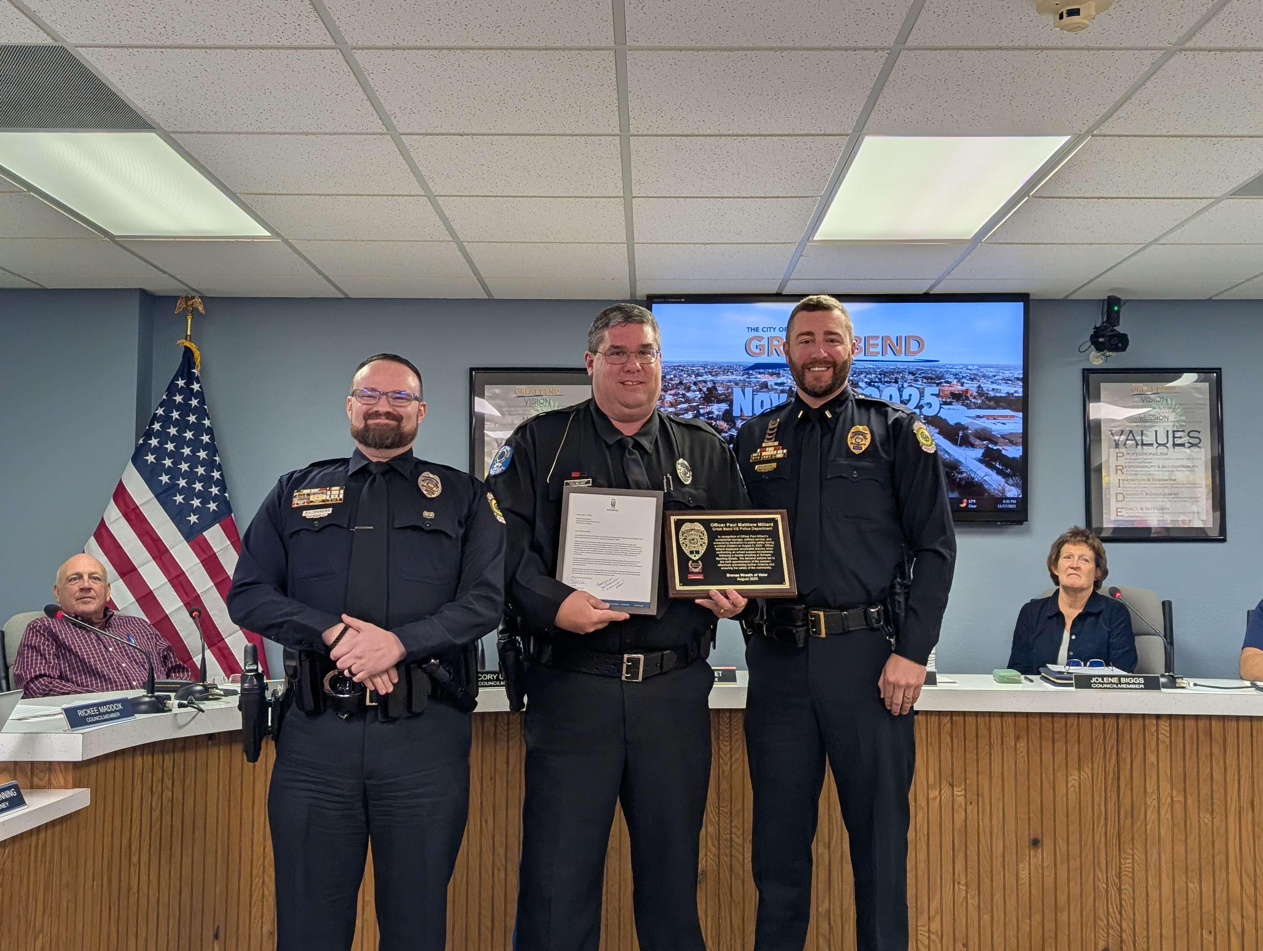 -From left: Wichita Police Dept. Det. Richard Rogers, Great Bend Police Dept. School Resource Officer Paul Millard, and Wichita Police Dept. Lt. Donald Moore during Monday's Great Bend City Council meeting. Rogers and Moore recognized Millard for his auctions as an off-duty officer during a August shooting in Wichita.